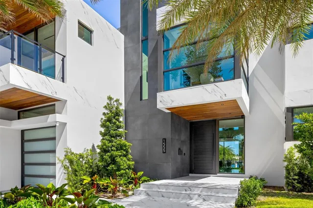 a kitchen with stainless steel appliances a sink a stove and a refrigerator