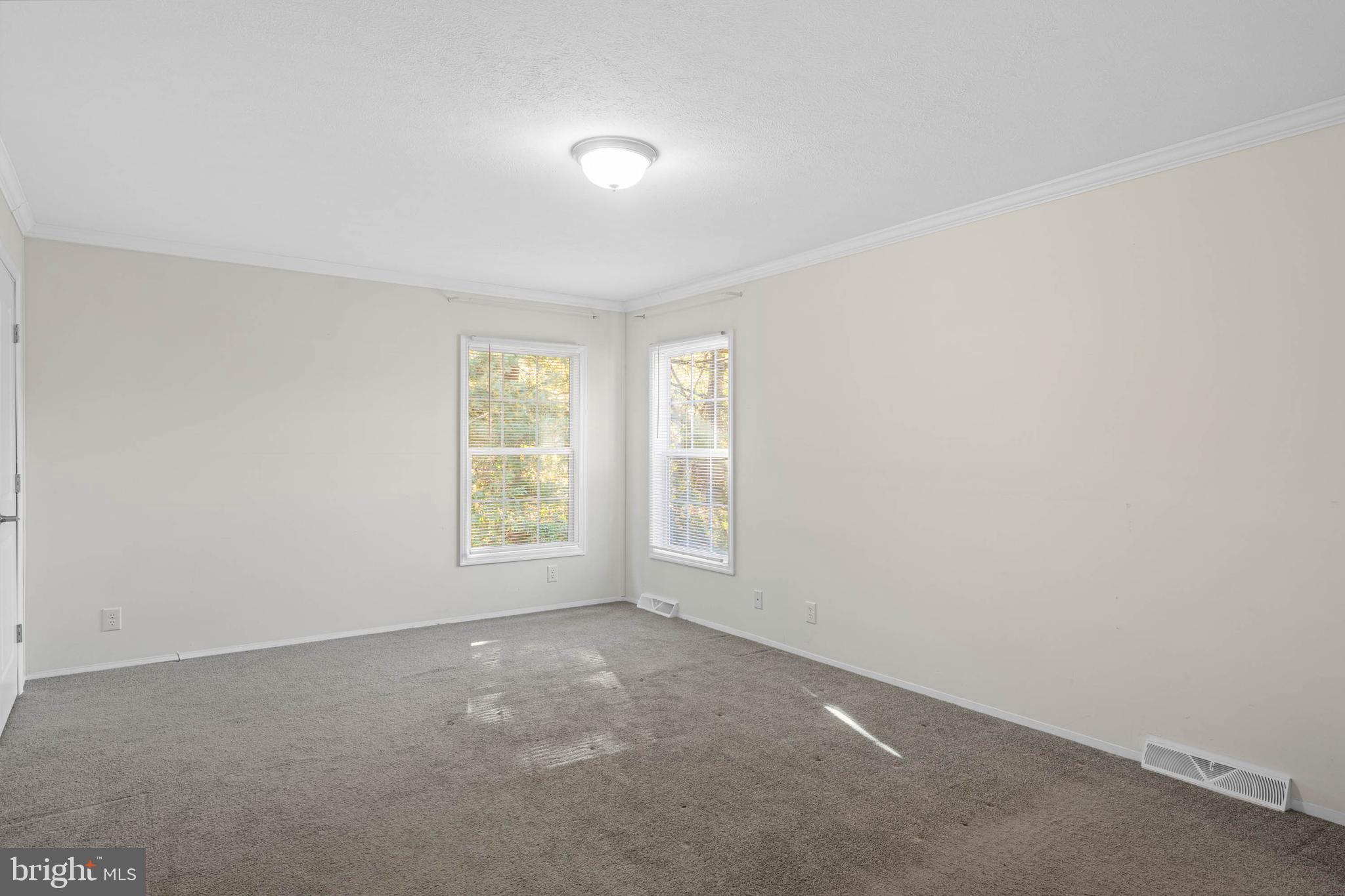 17247 Pine Water Drive Lewes, DE 19958 - Photo 13 of 32 an empty room with windows