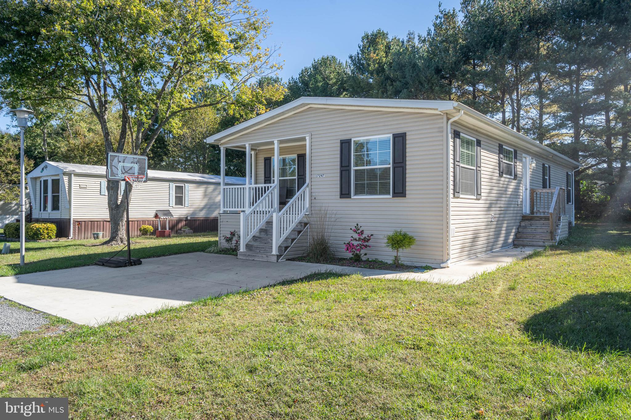 17247 Pine Water Drive Lewes, DE 19958 - Photo 22 of 32 a view of a house with a yard and garage