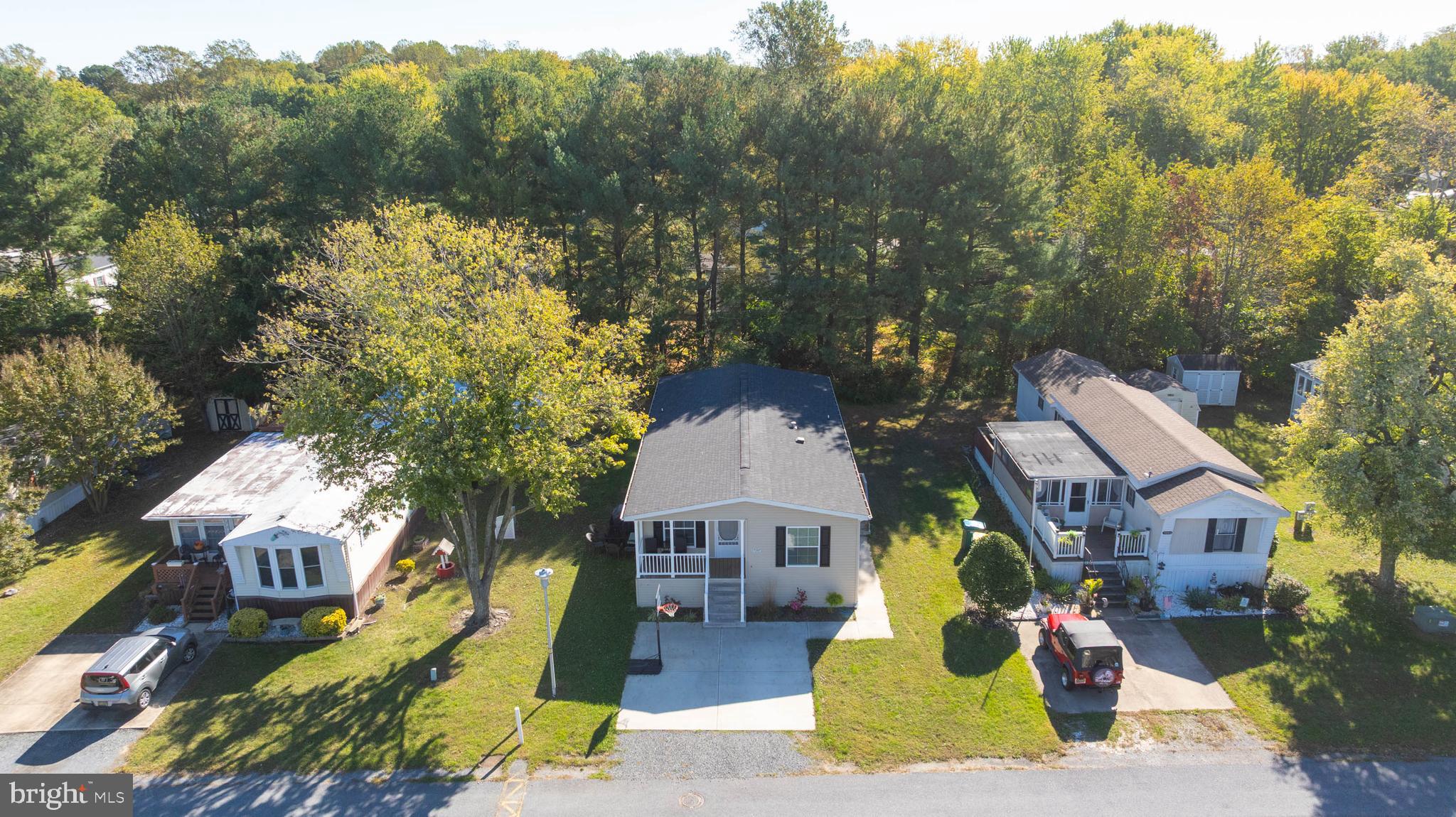 17247 Pine Water Drive Lewes, DE 19958 - Photo 24 of 32 a aerial view of a house with a yard and sitting area