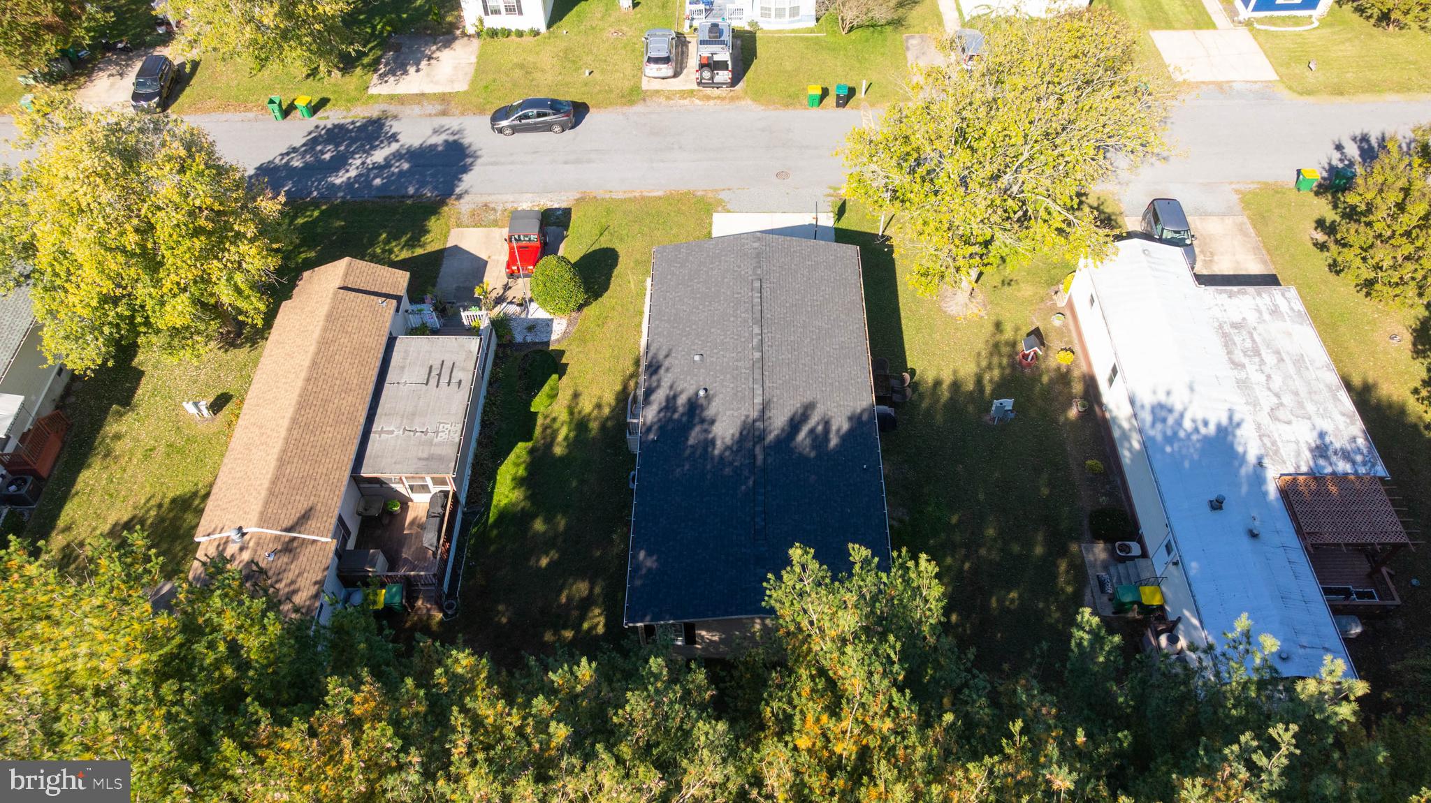 17247 Pine Water Drive Lewes, DE 19958 - Photo 26 of 32 an aerial view of a house with a yard and a large tree