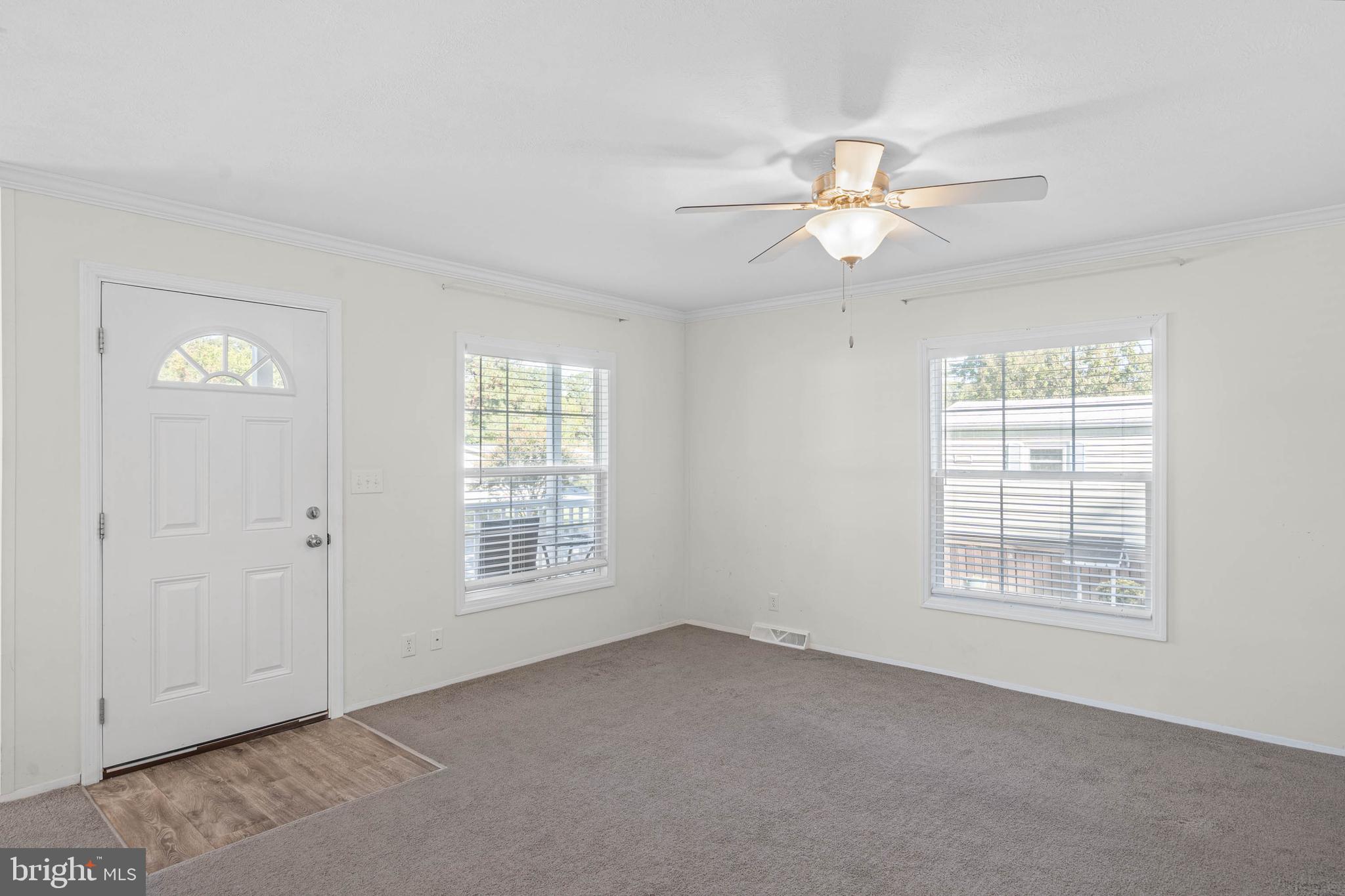 17247 Pine Water Drive Lewes, DE 19958 - Photo 7 of 32 a view of an empty room with a window