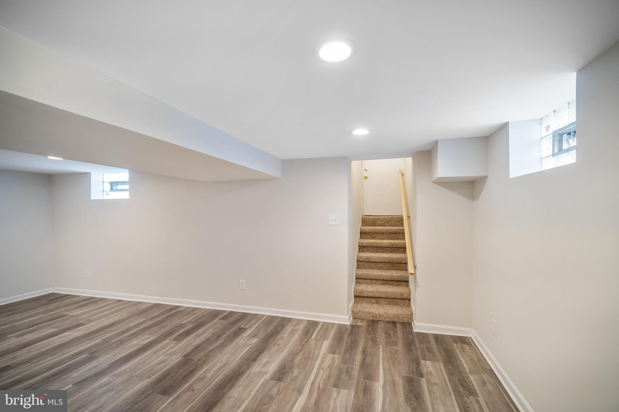 4110 Belle Grove Road Baltimore, MD 21225 - Photo 25 of 34 Basement great room with door to back yard