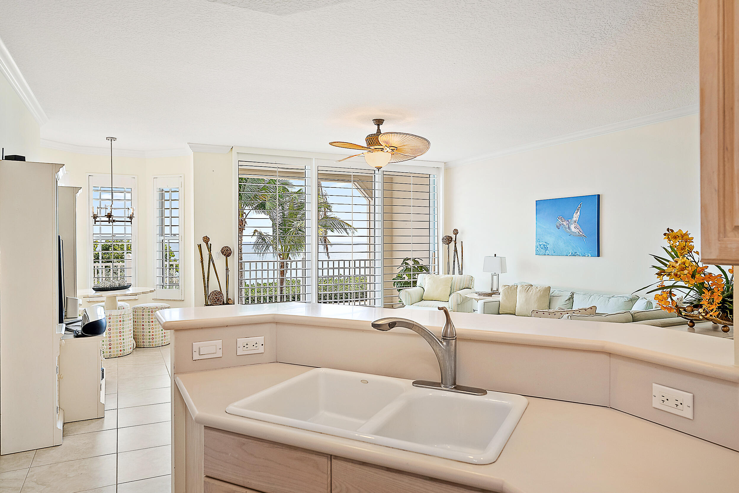 221 Ocean Grande Boulevard, Unit 407 Jupiter, FL 33477 - Photo 11 of 39 a living room with furniture and large windows