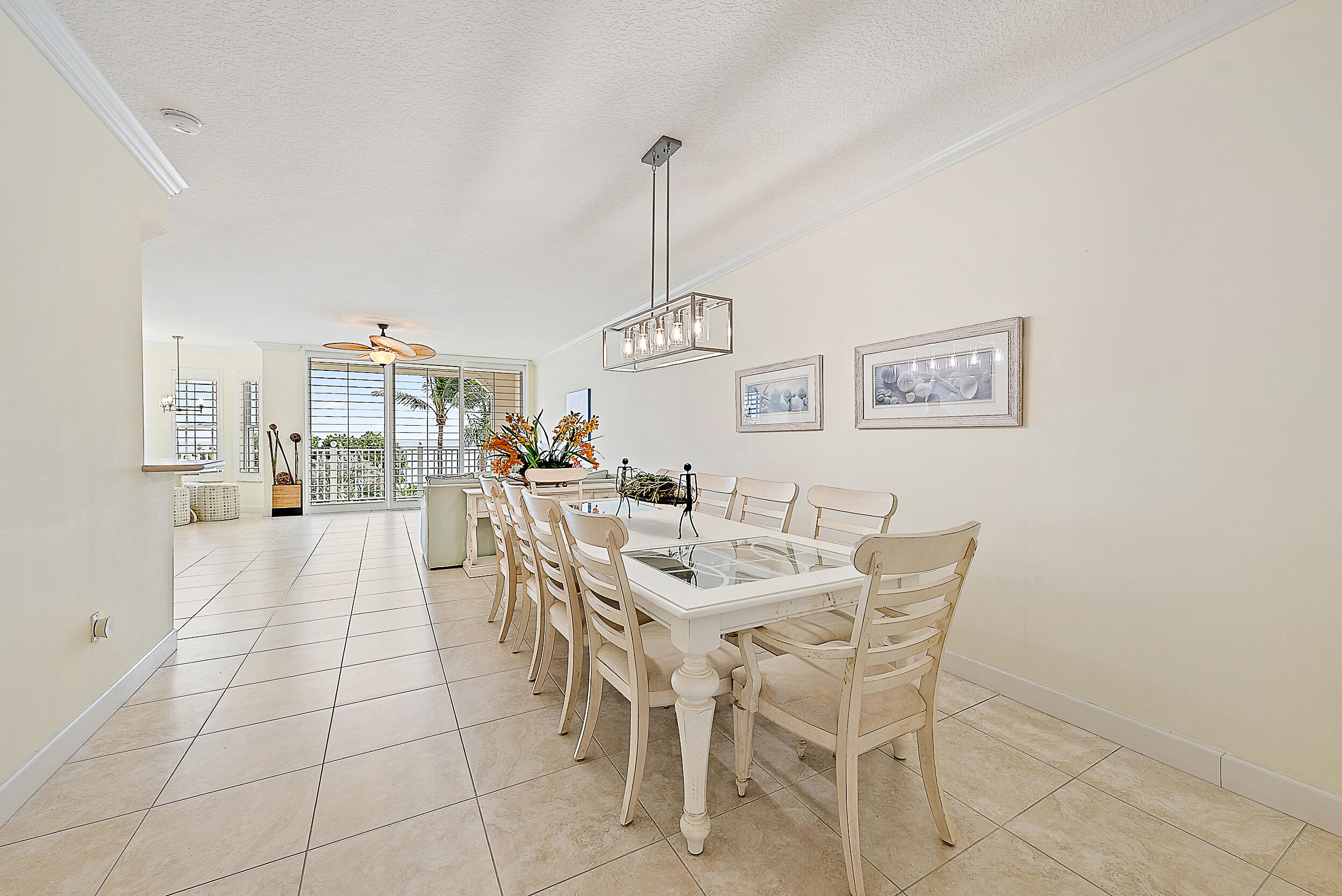 221 Ocean Grande Boulevard, Unit 407 Jupiter, FL 33477 - Photo 12 of 39 a view of a dining room with furniture
