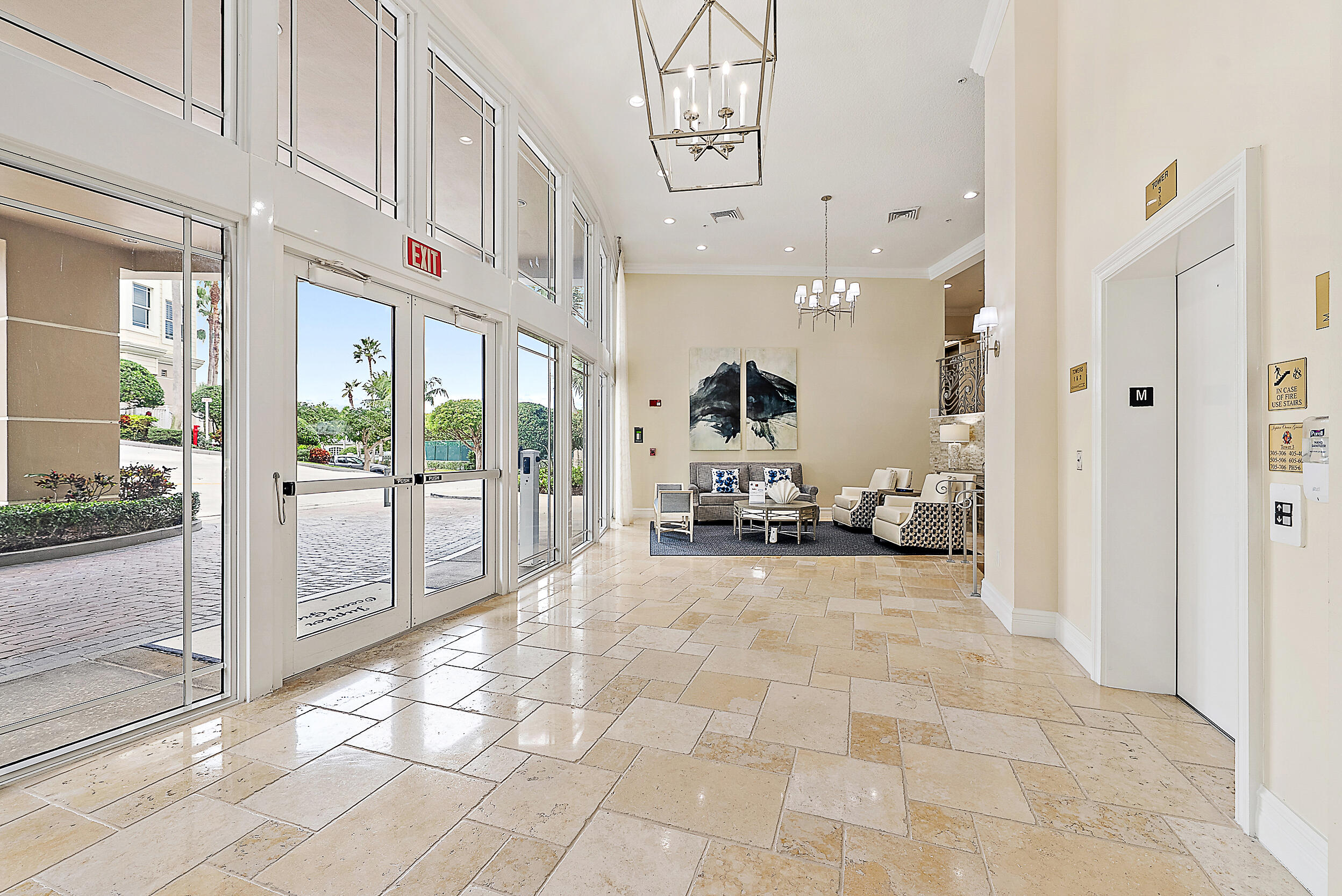 221 Ocean Grande Boulevard, Unit 407 Jupiter, FL 33477 - Photo 25 of 39 a view of a hallway with dining table and chairs