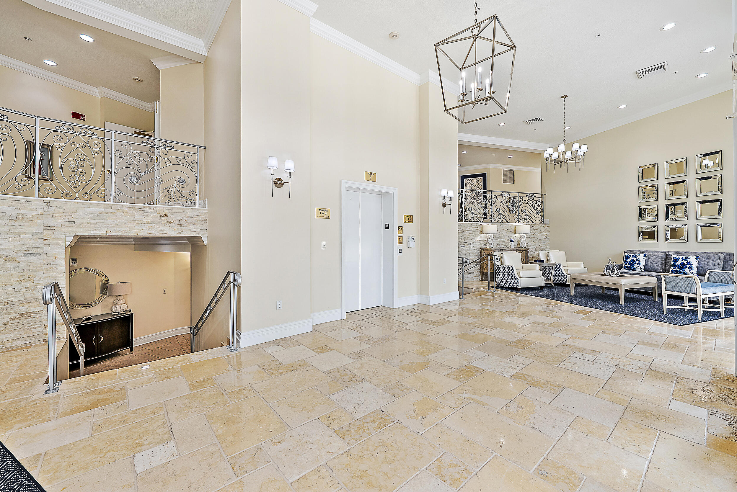 221 Ocean Grande Boulevard, Unit 407 Jupiter, FL 33477 - Photo 26 of 39 a living room with furniture large window and flat screen tv