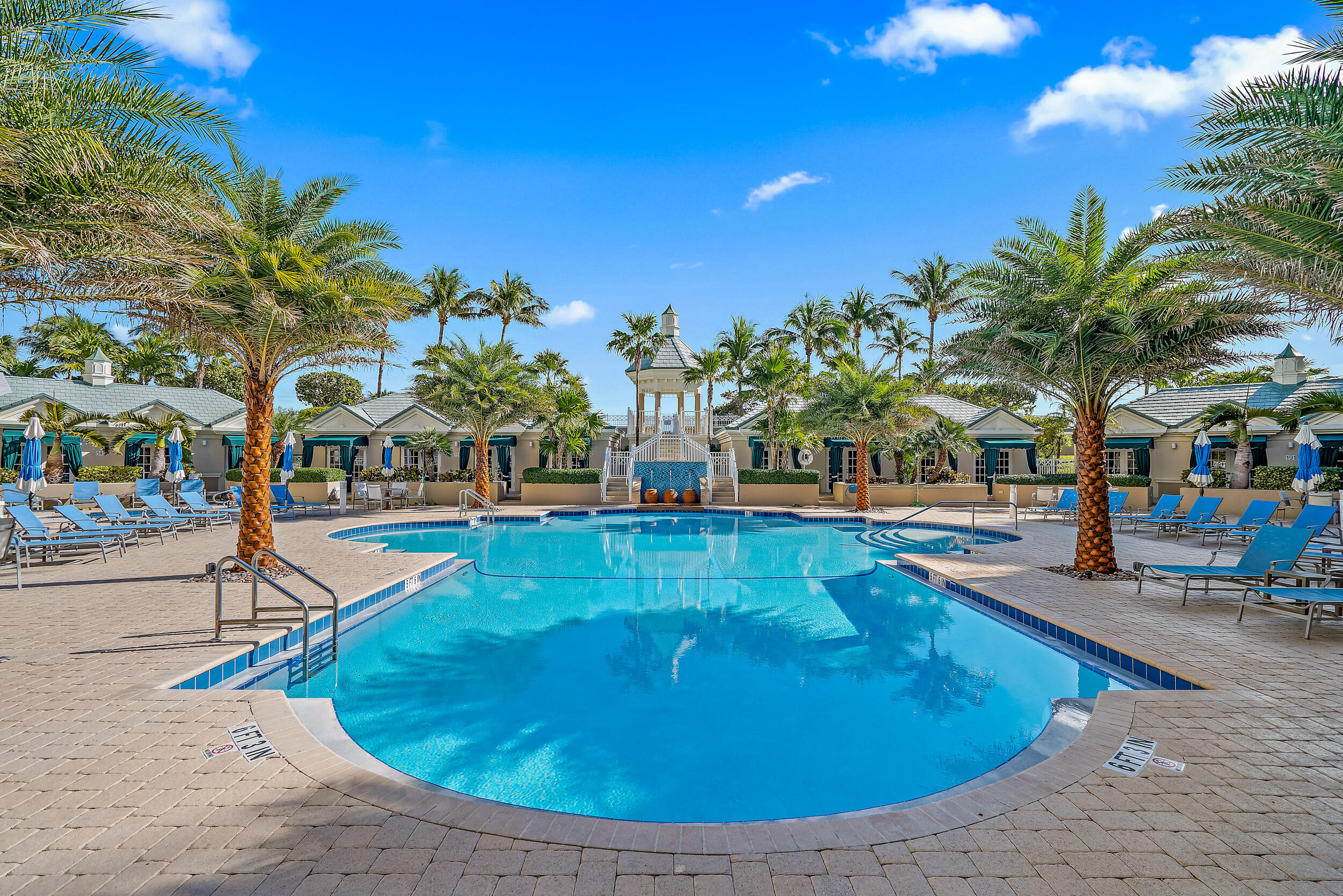 221 Ocean Grande Boulevard, Unit 407 Jupiter, FL 33477 - Photo 30 of 39 a view of a swimming pool with an outdoor seating