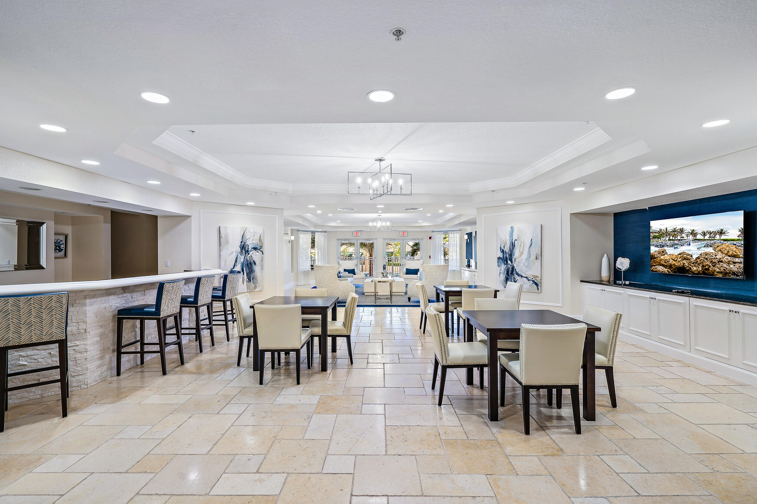 221 Ocean Grande Boulevard, Unit 407 Jupiter, FL 33477 - Photo 33 of 39 a view of a dining area with furniture