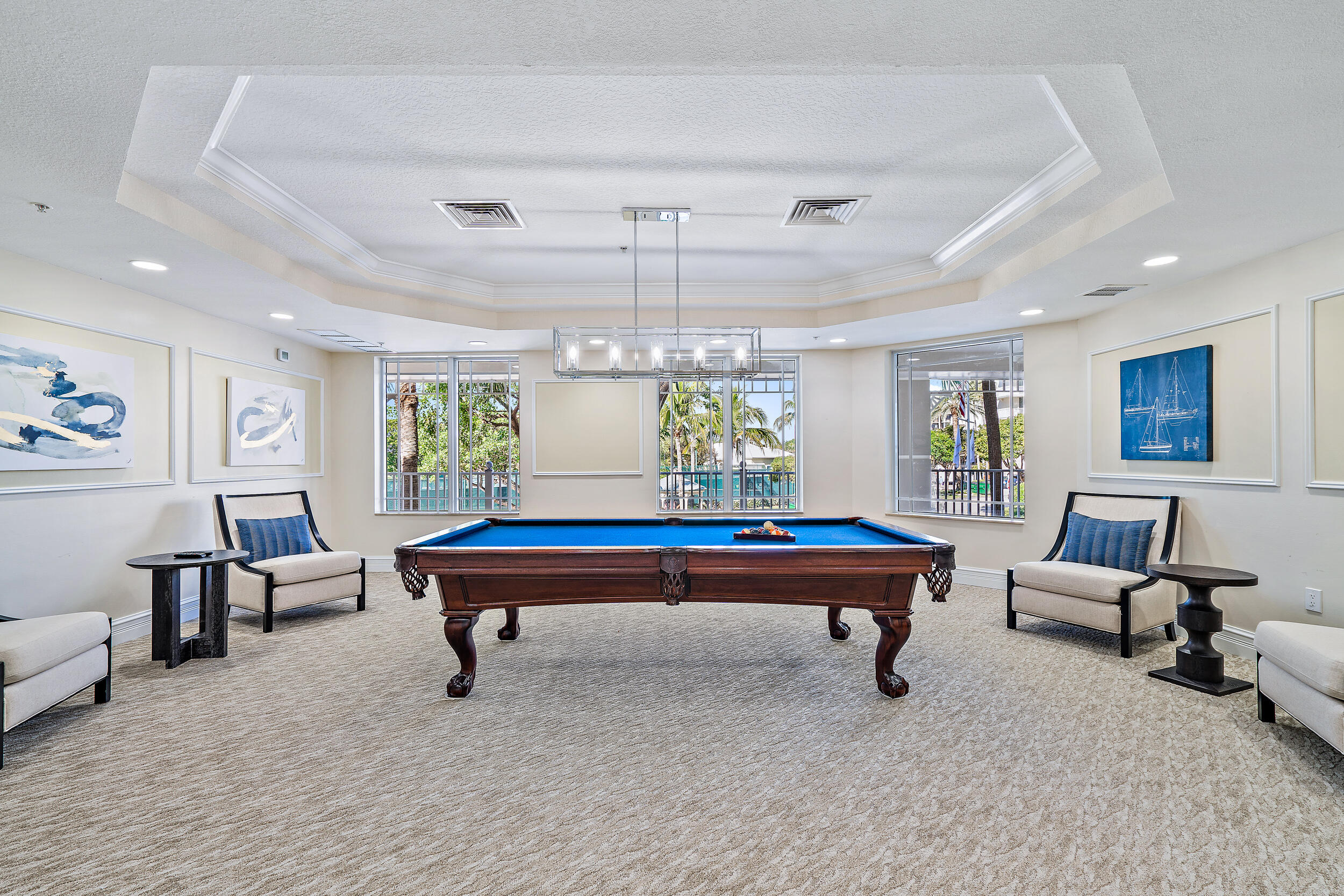 221 Ocean Grande Boulevard, Unit 407 Jupiter, FL 33477 - Photo 34 of 39 a room with furniture pool table and windows
