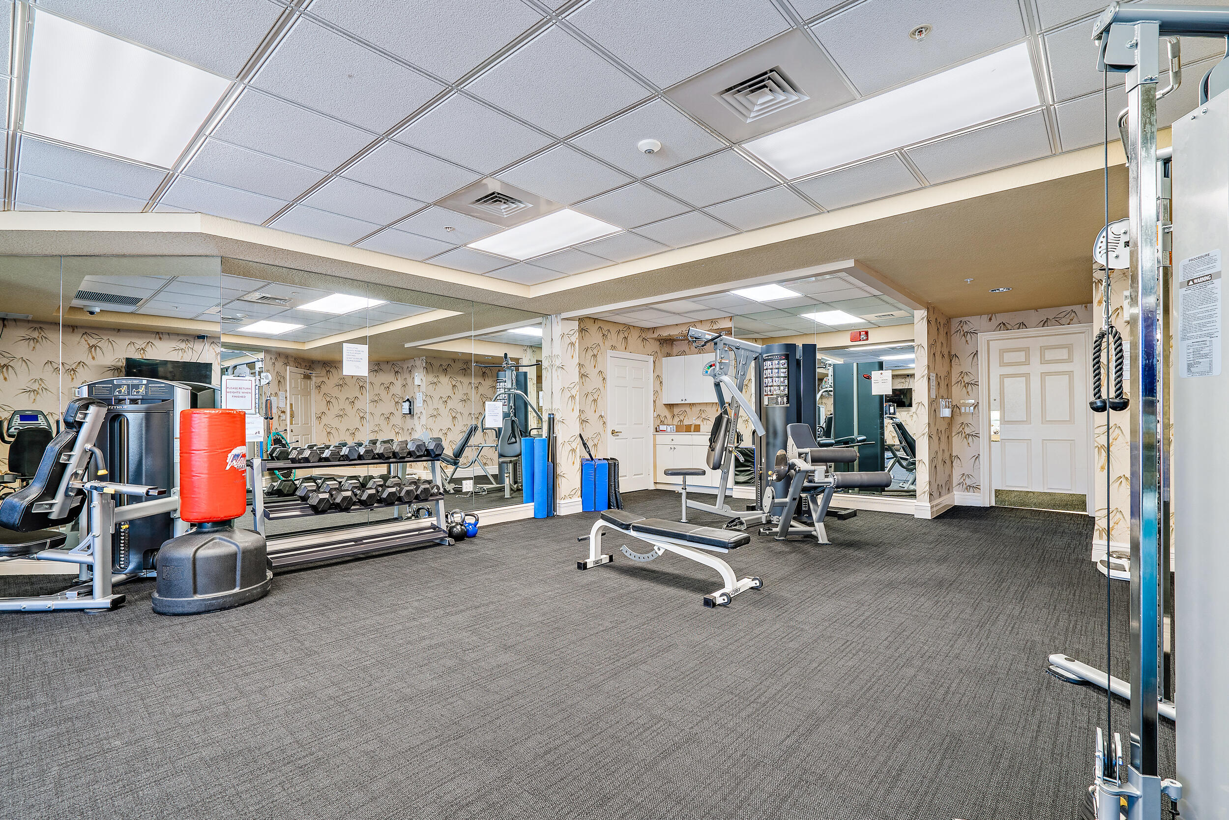 221 Ocean Grande Boulevard, Unit 407 Jupiter, FL 33477 - Photo 35 of 39 a view of a room with gym equipment