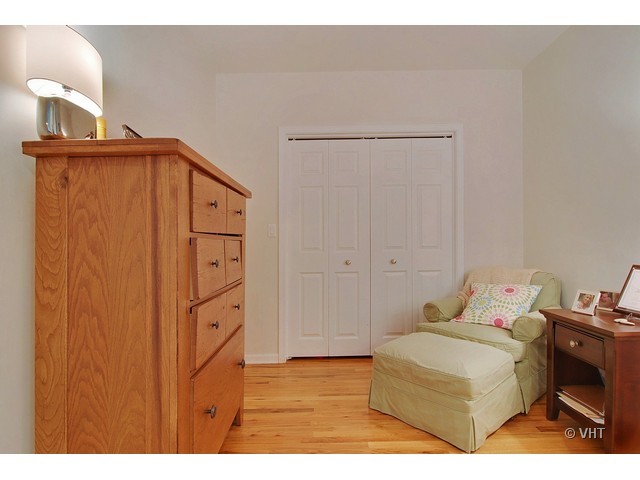 657 West Fulton Street, Unit 501 Chicago, IL 60661 - Photo 6 of 11 a bedroom with a bed and a cabinets