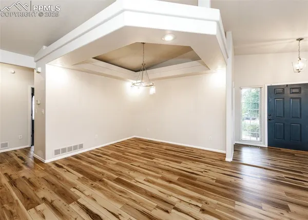 a view of a livingroom with wooden floor