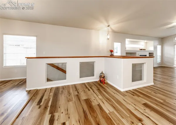 a view of kitchen with wooden floor