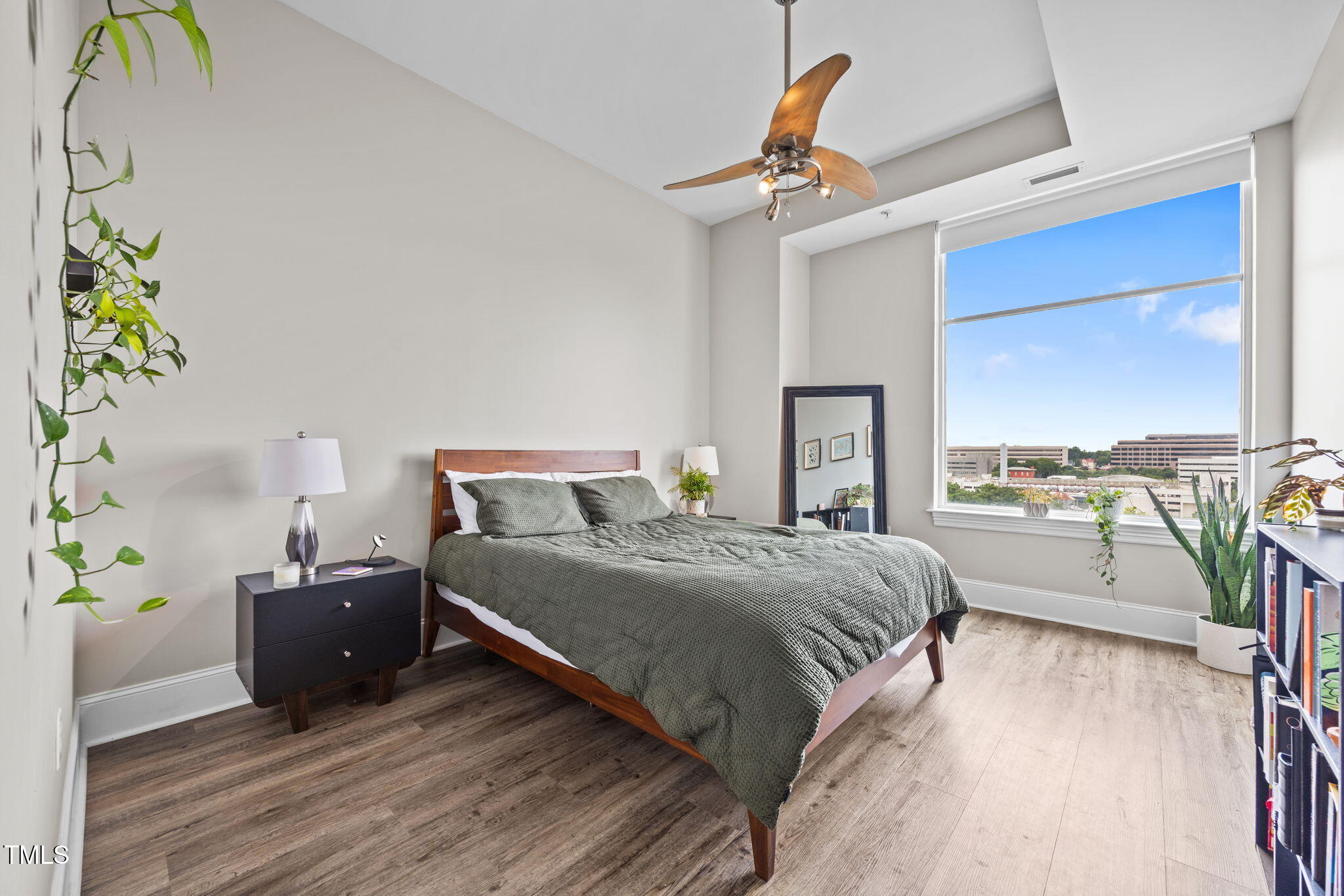 400 West North Street, Unit 1028 Raleigh, NC 27603 - Photo 15 of 37 a spacious bedroom with a bed and window