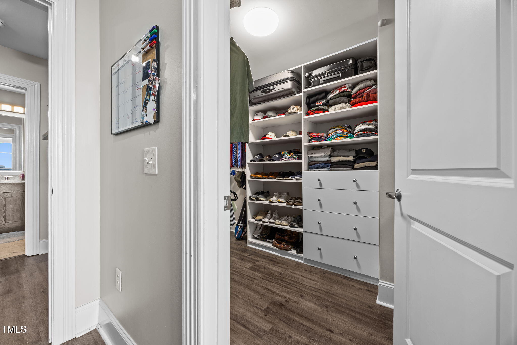 400 West North Street, Unit 1028 Raleigh, NC 27603 - Photo 20 of 37 walk in closet with wooden floor