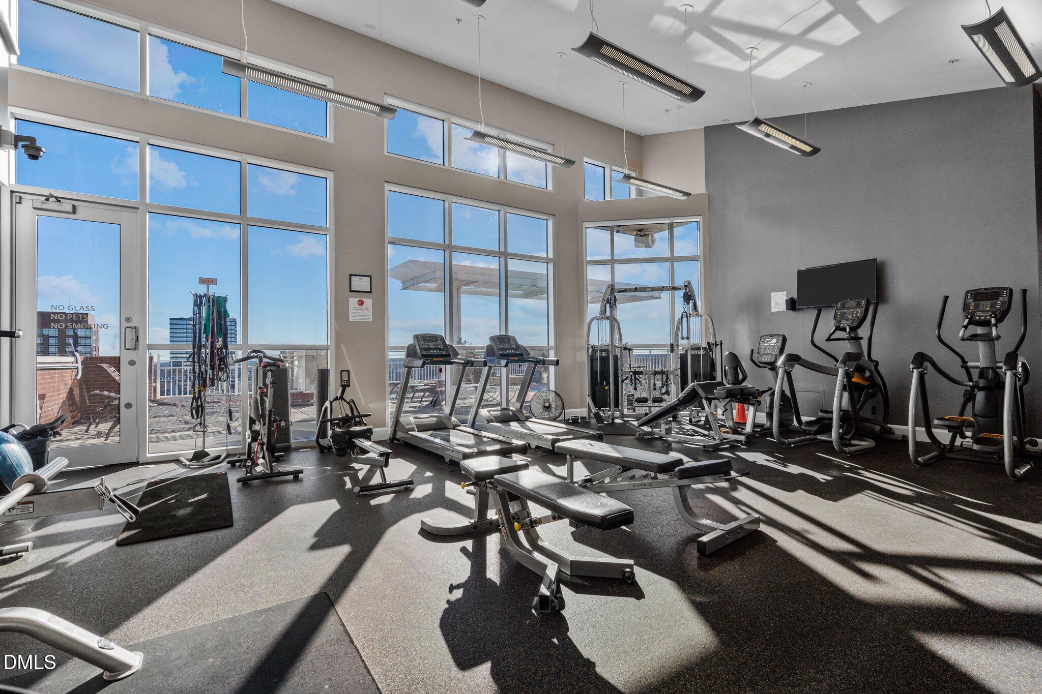 400 West North Street, Unit 1028 Raleigh, NC 27603 - Photo 31 of 37 a view of a room with gym equipment