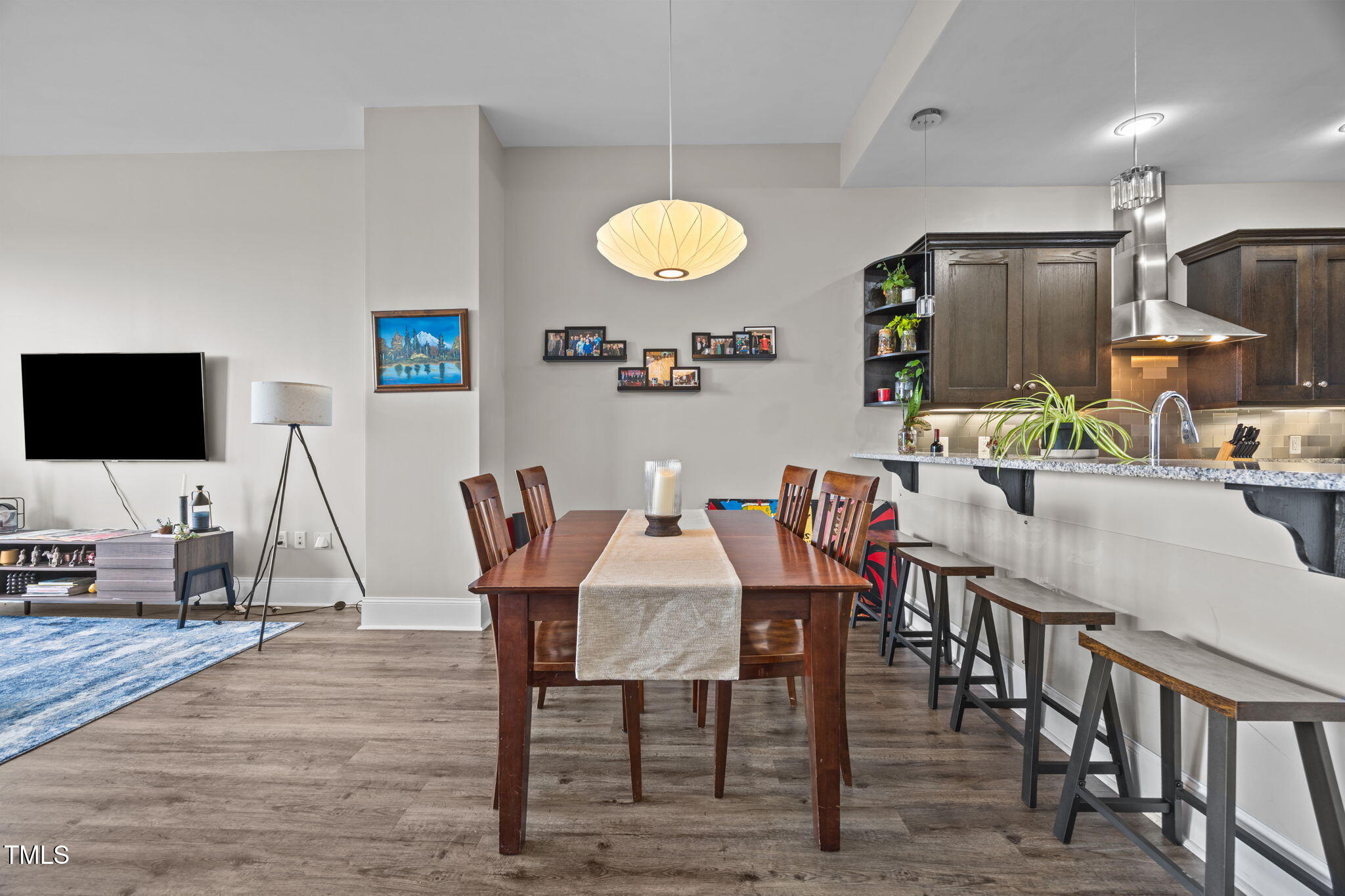 400 West North Street, Unit 1028 Raleigh, NC 27603 - Photo 9 of 37 a view of a dining room with furniture