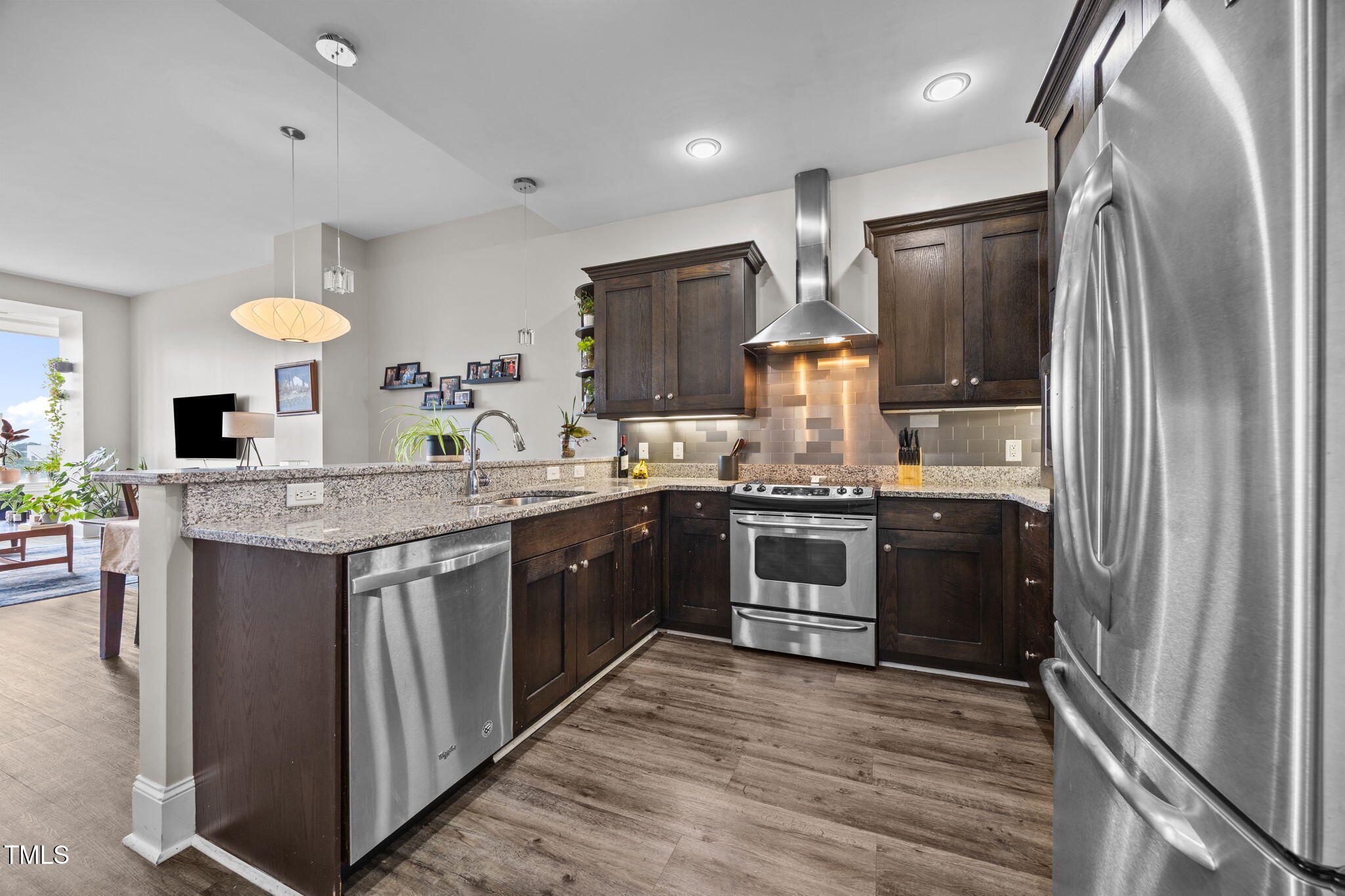 400 West North Street, Unit 1028 Raleigh, NC 27603 - Photo 10 of 37 a kitchen with stainless steel appliances granite countertop a refrigerator stove and sink