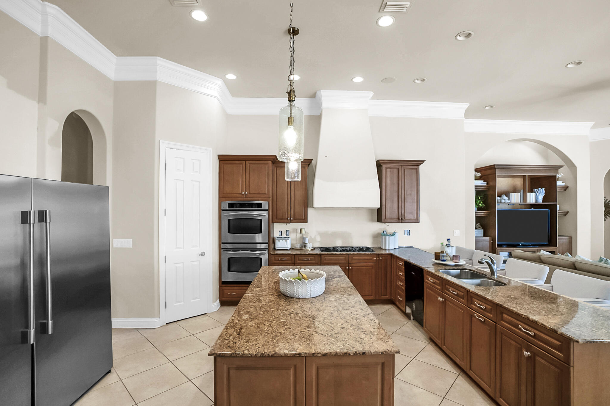4372 Stonebridge Road Destin, FL 32541 - Photo 14 of 83 a large kitchen with granite countertop a sink a counter top space appliances and cabinets