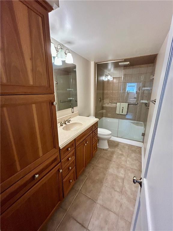 239 Marshall Road Oakdale, PA 15071 - Photo 23 of 41 a bathroom with a double vanity sink a toilet and a shower