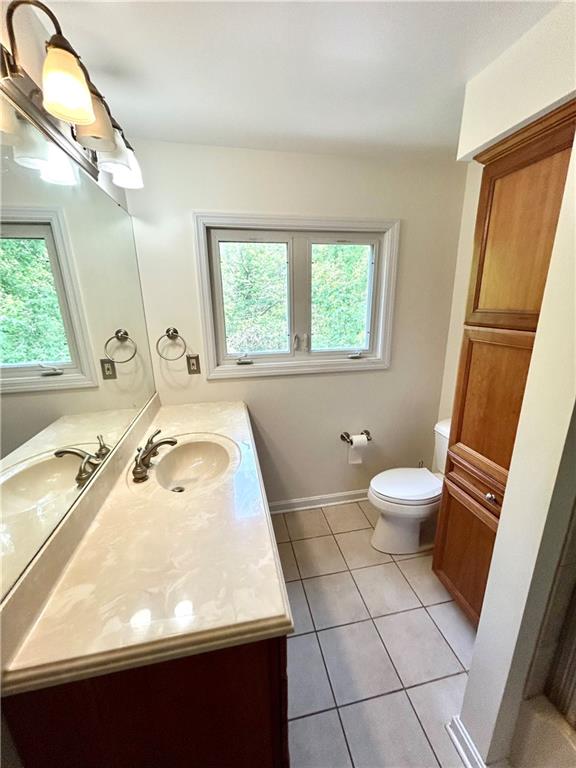 239 Marshall Road Oakdale, PA 15071 - Photo 26 of 41 a bathroom with a sink a toilet a mirror and window