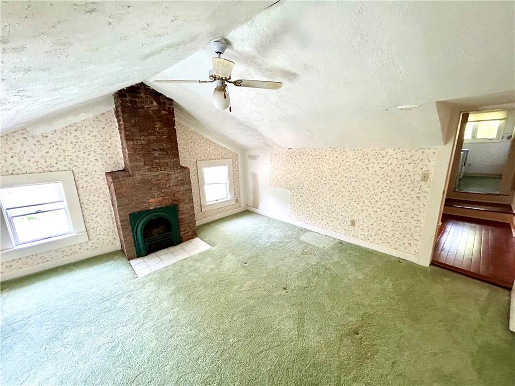 239 Marshall Road Oakdale, PA 15071 - Photo 30 of 41 a view of empty room with fireplace and wooden floor