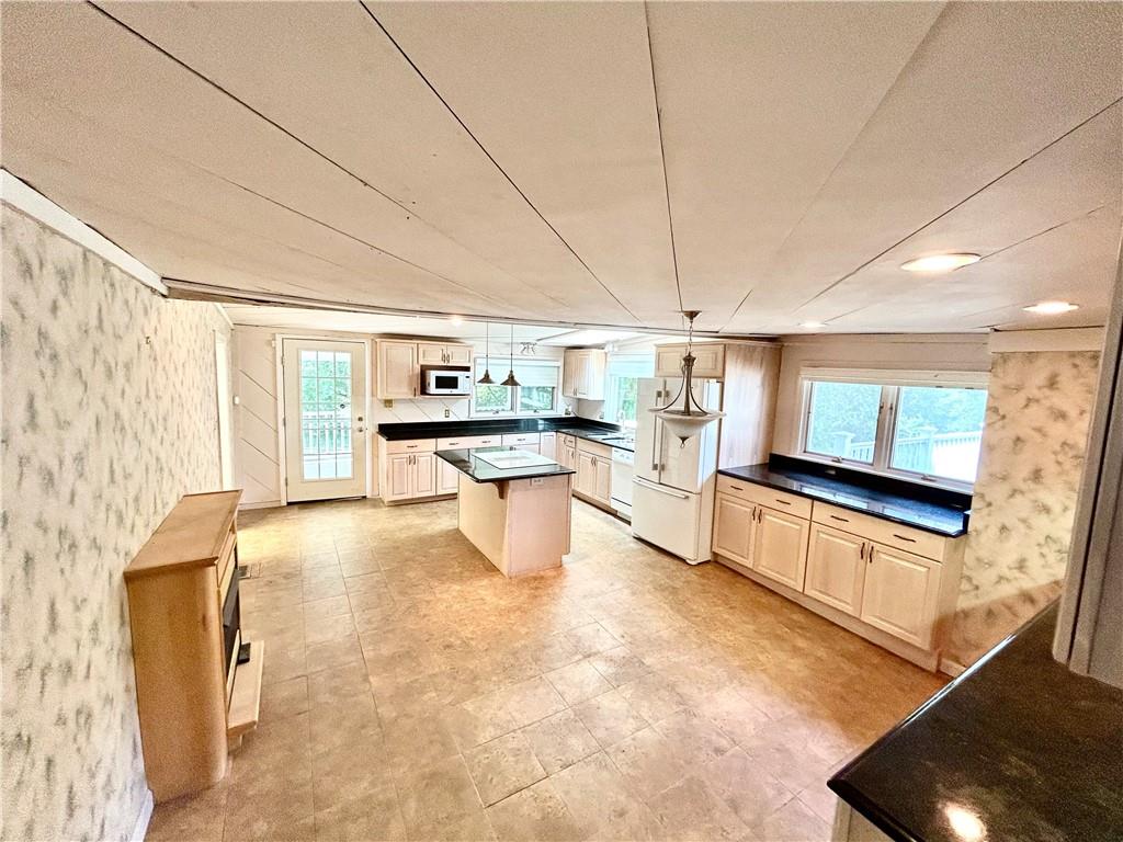 239 Marshall Road Oakdale, PA 15071 - Photo 10 of 41 a kitchen with stainless steel appliances granite countertop a sink and cabinets