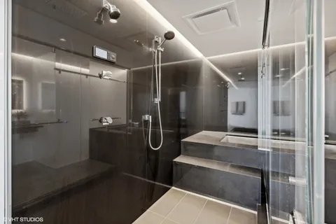 a bathroom with a mirror and double vanity