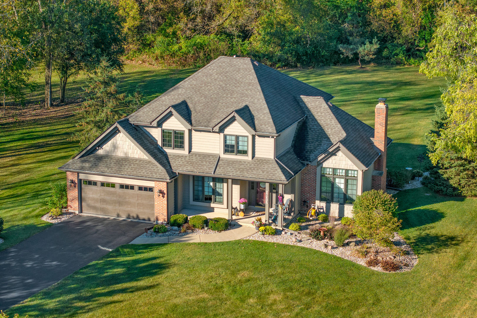 a aerial view of a house with swimming pool and porch