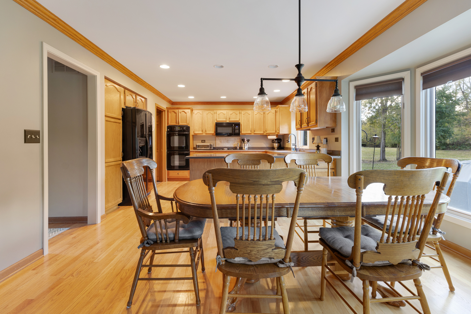 10317 Ridge Lane Huntley, IL 60142 - Photo 16 of 42 a view of a dining room with furniture window and outside view