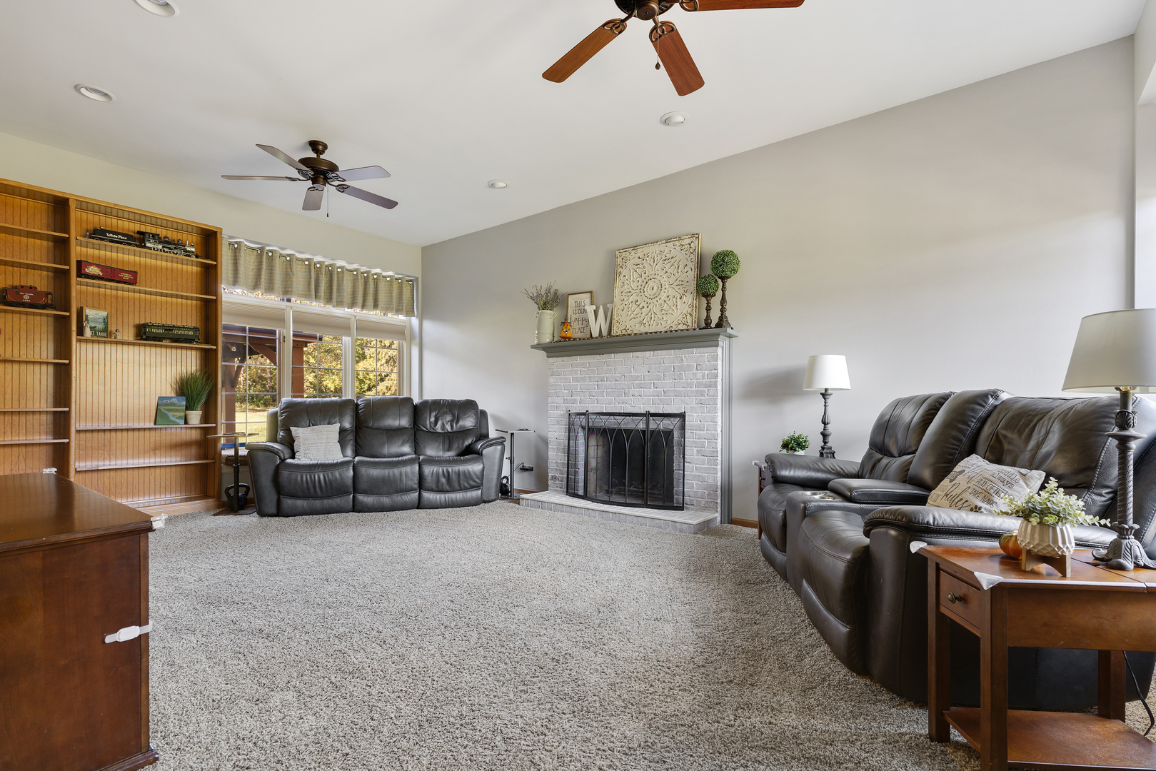 10317 Ridge Lane Huntley, IL 60142 - Photo 18 of 42 a living room with furniture and a fireplace