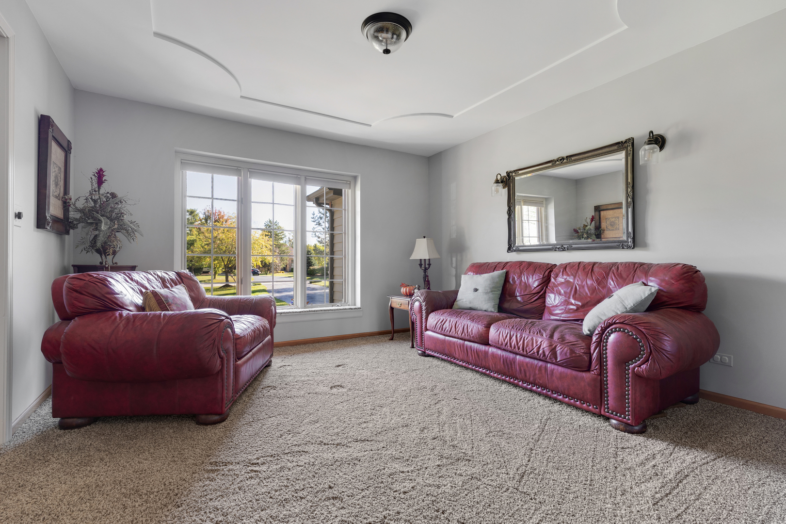 10317 Ridge Lane Huntley, IL 60142 - Photo 20 of 42 a living room with furniture and a large window