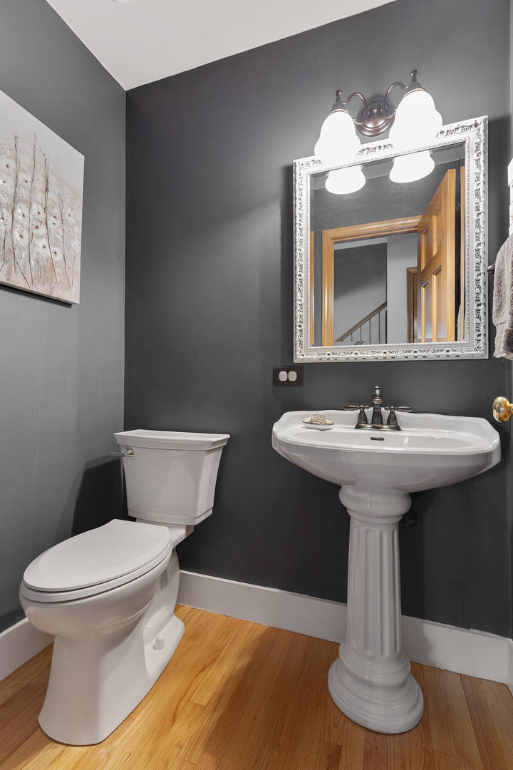 10317 Ridge Lane Huntley, IL 60142 - Photo 23 of 42 a bathroom with a toilet sink and mirror