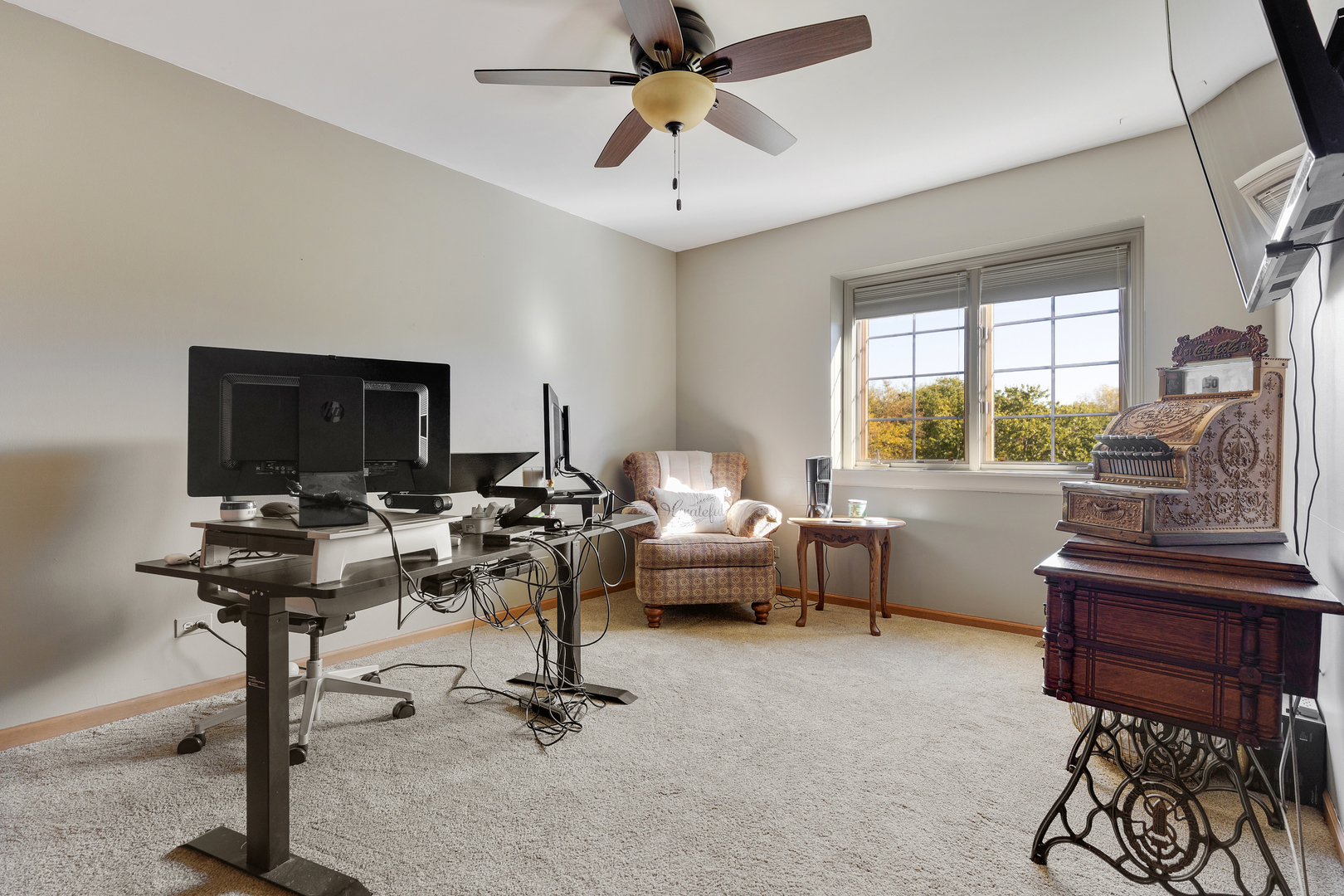 10317 Ridge Lane Huntley, IL 60142 - Photo 28 of 42 a living room with furniture a flat screen tv and a window