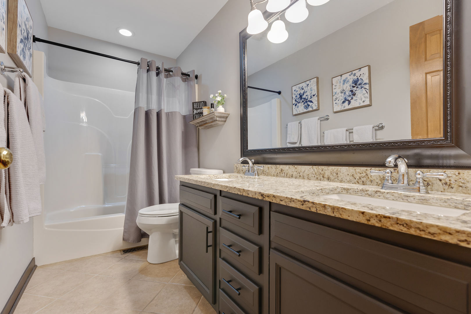 10317 Ridge Lane Huntley, IL 60142 - Photo 30 of 42 a bathroom with a granite countertop sink toilet and shower