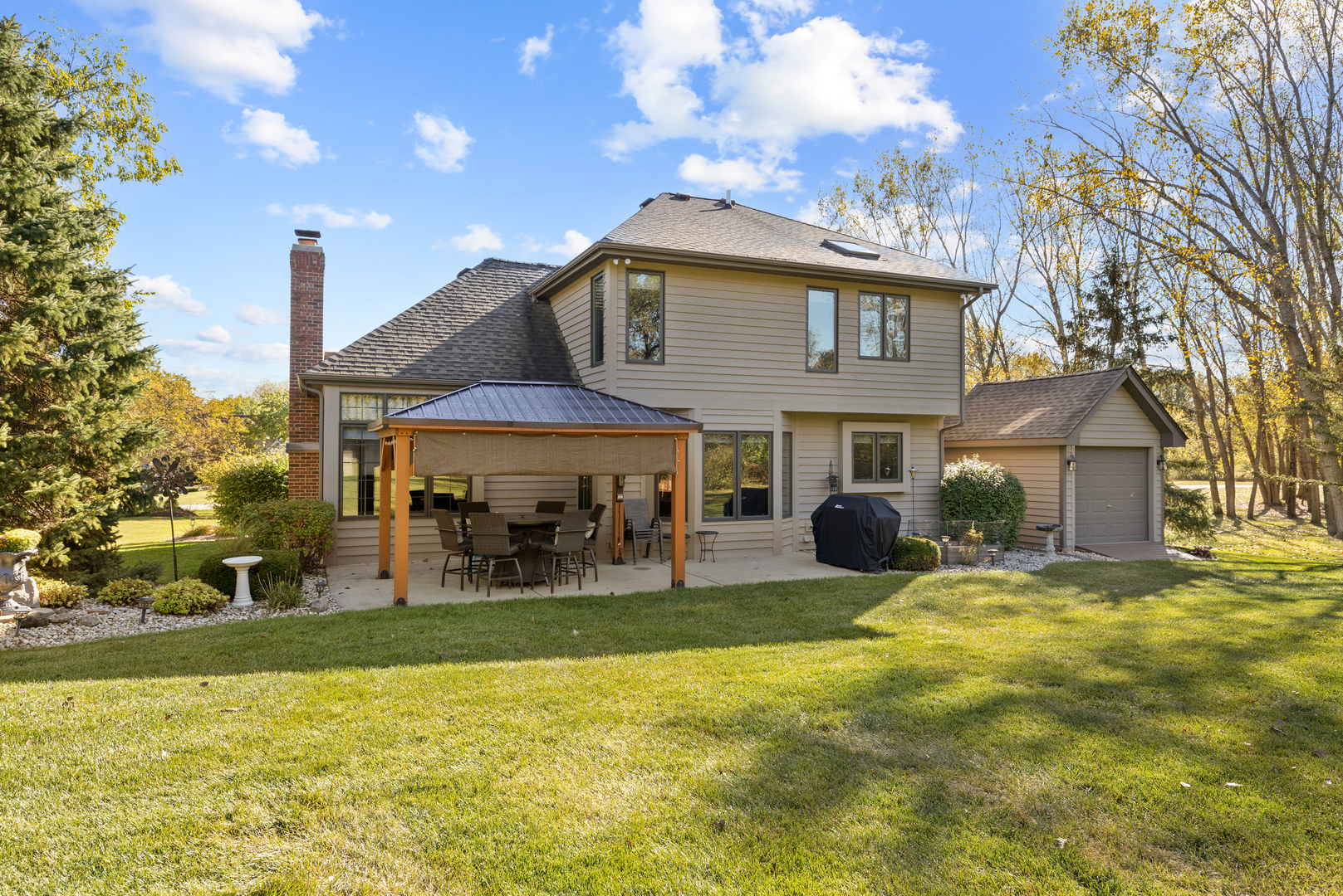 10317 Ridge Lane Huntley, IL 60142 - Photo 3 of 42 a view of a house with a yard patio and fire pit