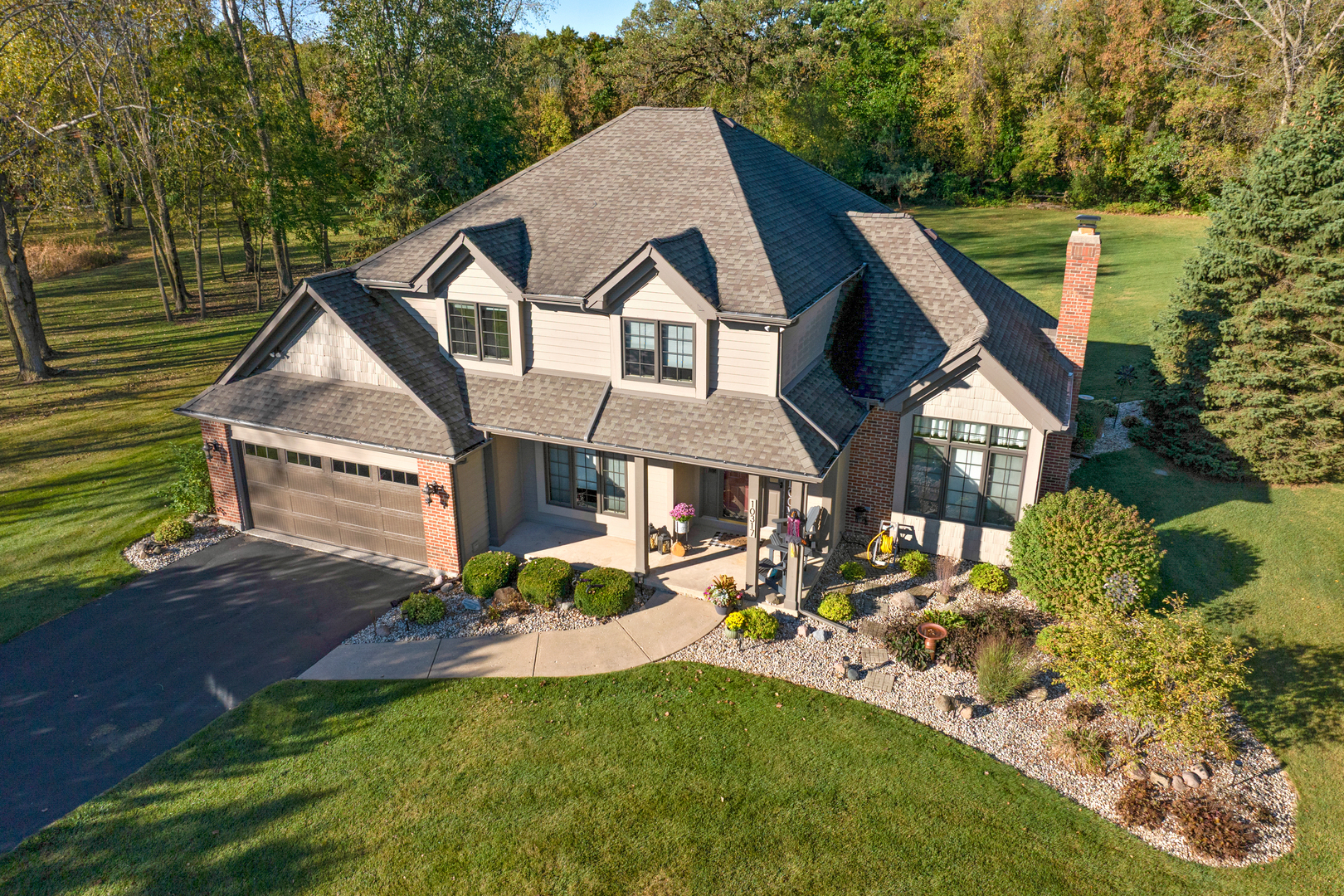 10317 Ridge Lane Huntley, IL 60142 - Photo 36 of 42 a front view of a house with garden
