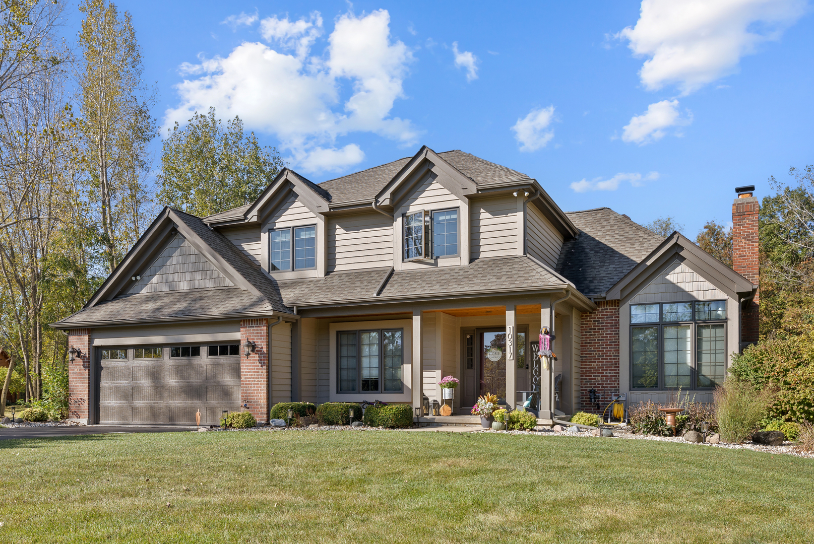 10317 Ridge Lane Huntley, IL 60142 - Photo 37 of 42 a front view of a house with a yard