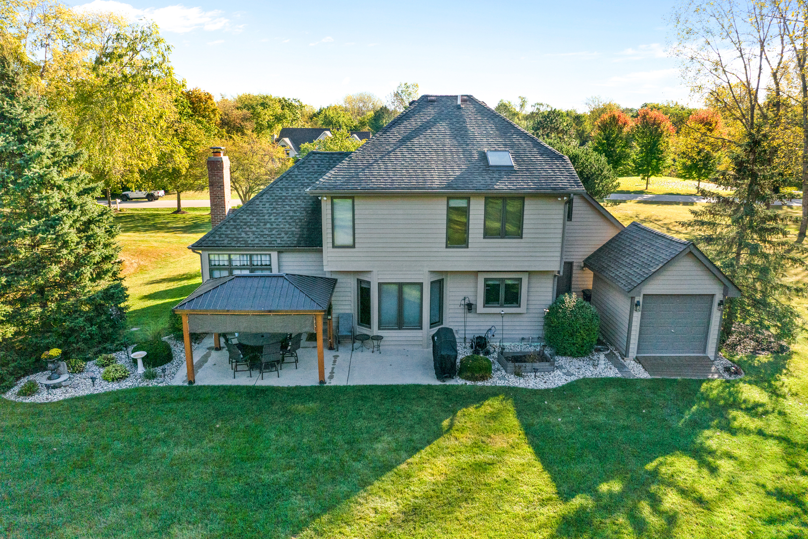 10317 Ridge Lane Huntley, IL 60142 - Photo 4 of 42 a view of a house with a yard patio and a garden