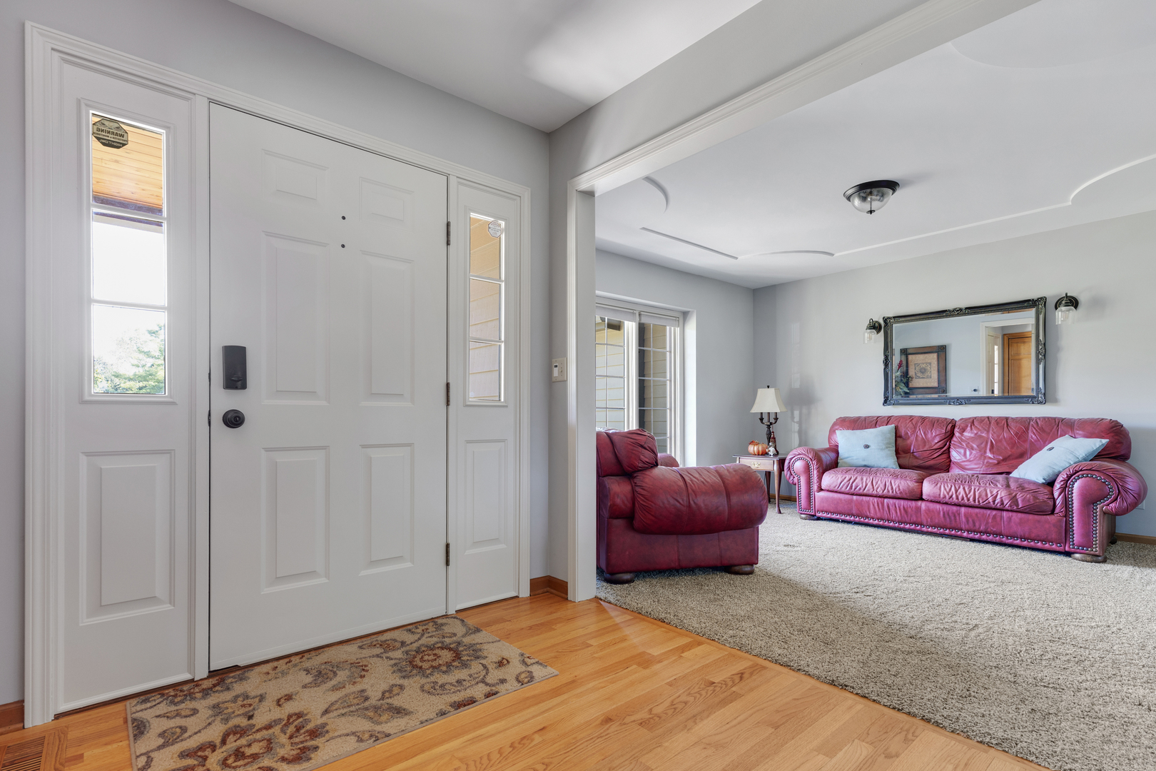 10317 Ridge Lane Huntley, IL 60142 - Photo 10 of 42 a bedroom with a bed and couch