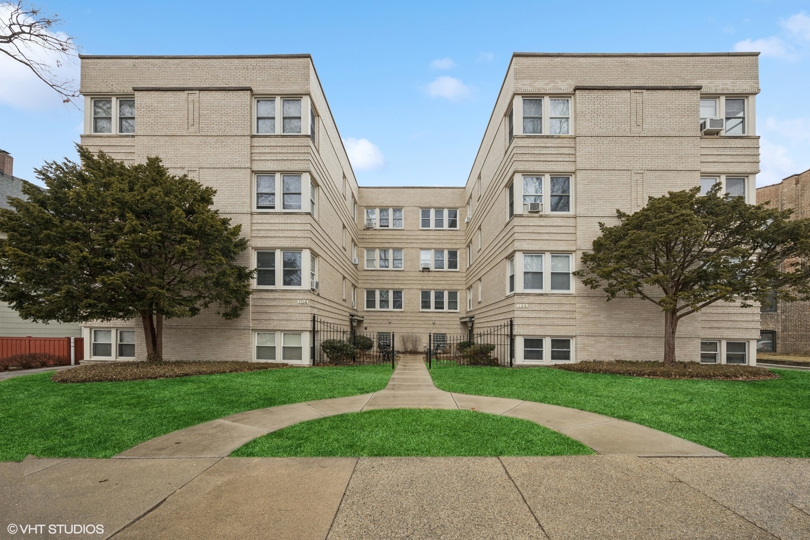 front view of a building with a yard