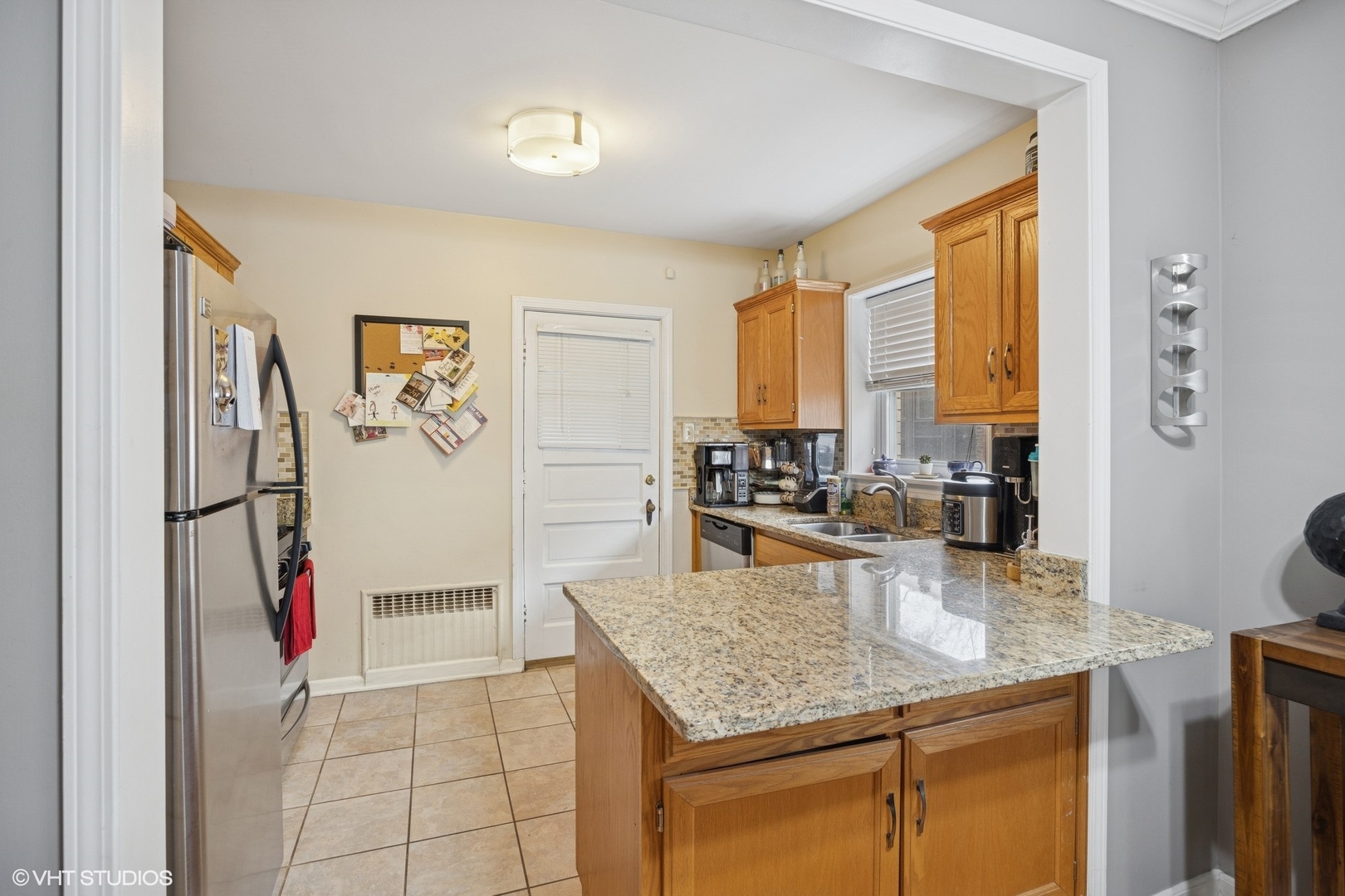 100 Pine Avenue, Unit 3 Riverside, IL 60546 - Photo 4 of 14 a kitchen with a refrigerator a sink and a counter top space