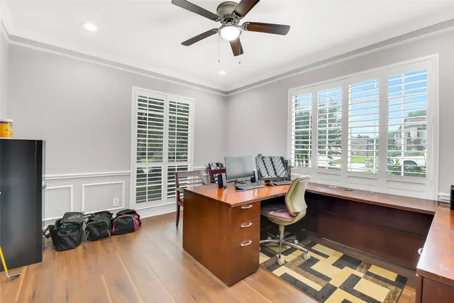 a work room with furniture and windows