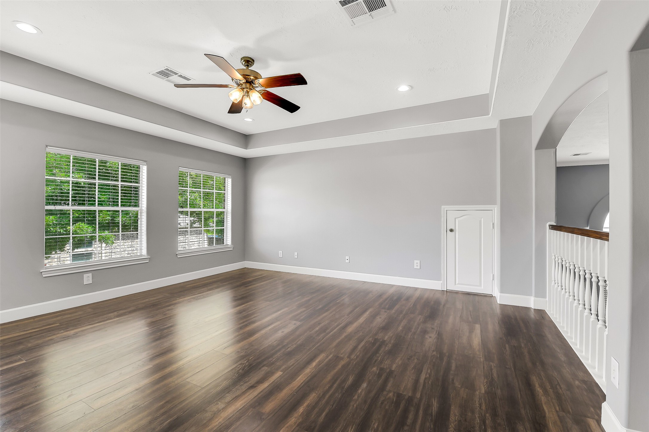 18414 Bull Pine Drive Spring, TX 77379 - Photo 19 of 43 a view of an empty room with wooden floor and a window