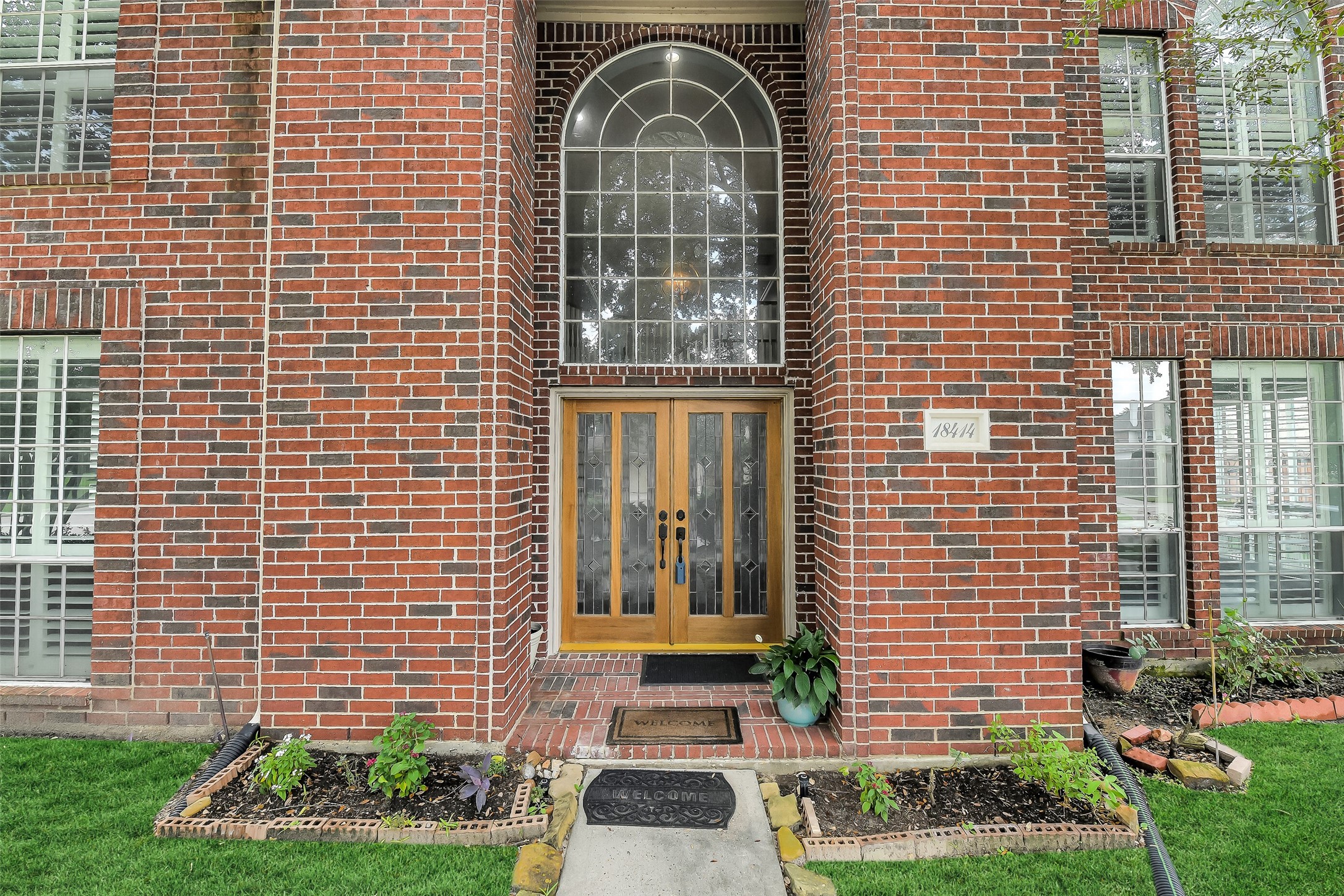 18414 Bull Pine Drive Spring, TX 77379 - Photo 2 of 43 a front view of a house with a garden