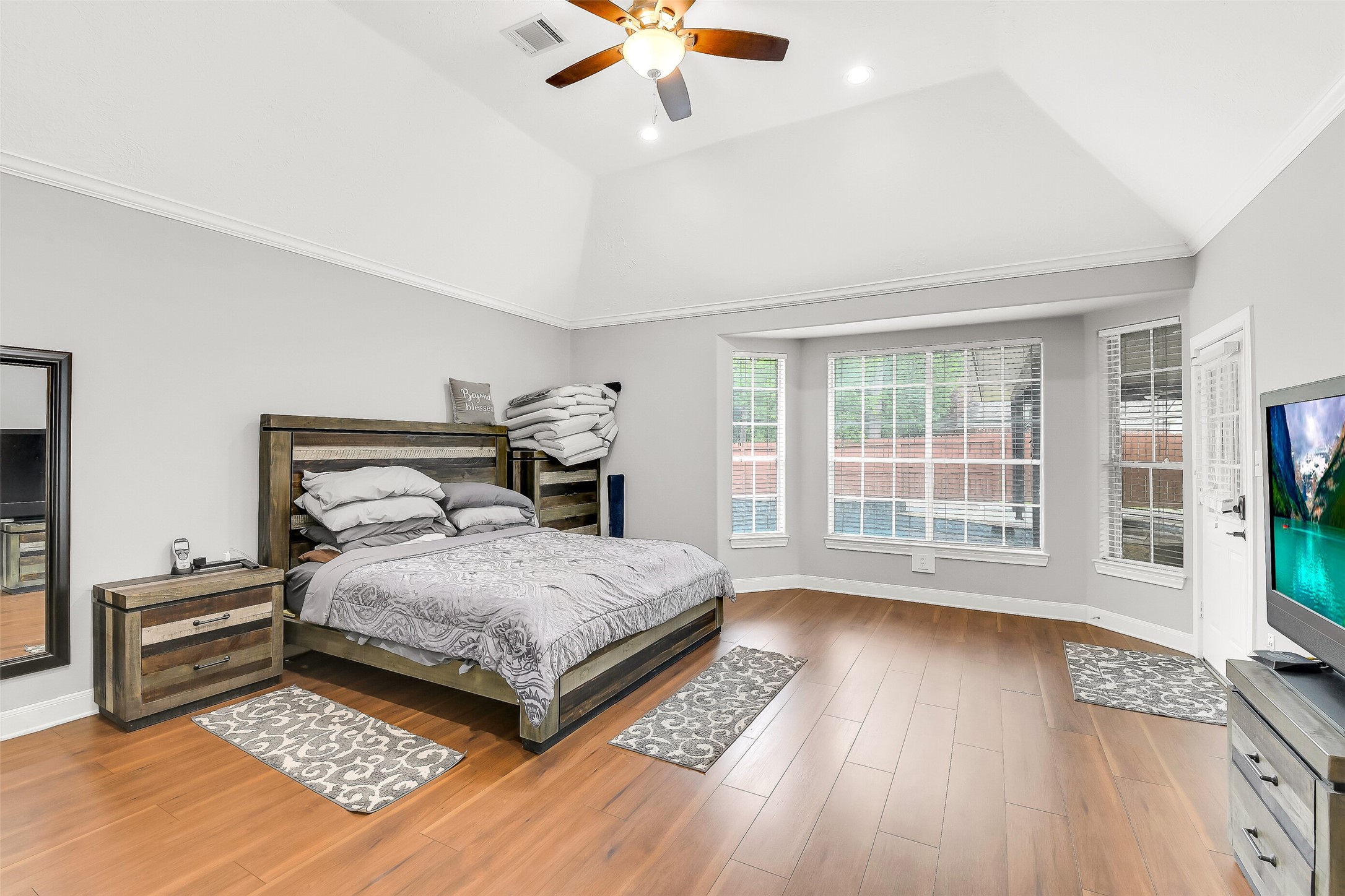 18414 Bull Pine Drive Spring, TX 77379 - Photo 28 of 43 a bedroom with a bed and a large window with wooden floor