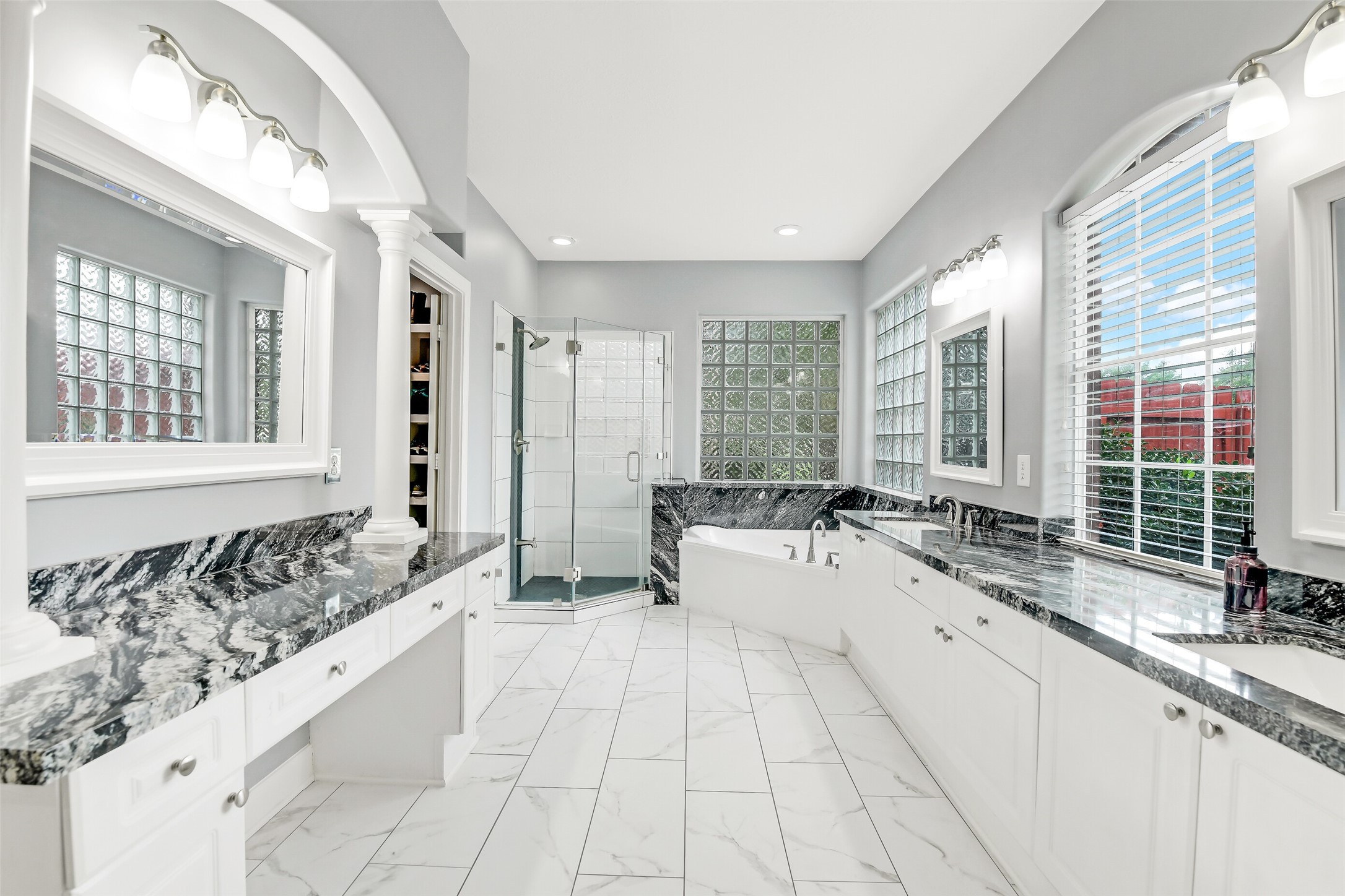 18414 Bull Pine Drive Spring, TX 77379 - Photo 30 of 43 a large white kitchen with a large window and stainless steel appliances