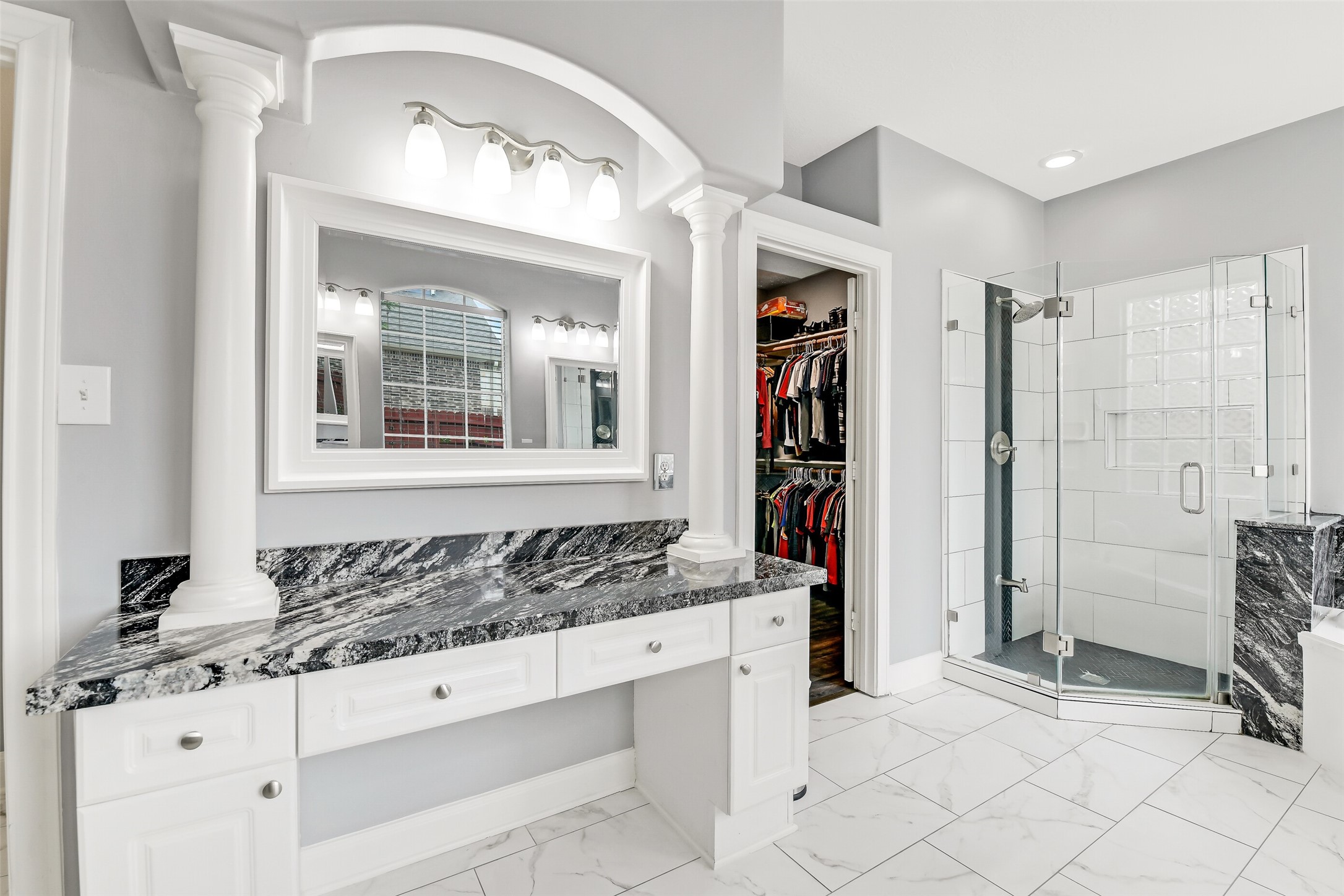 18414 Bull Pine Drive Spring, TX 77379 - Photo 31 of 43 a bathroom with a granite countertop sink and a mirror