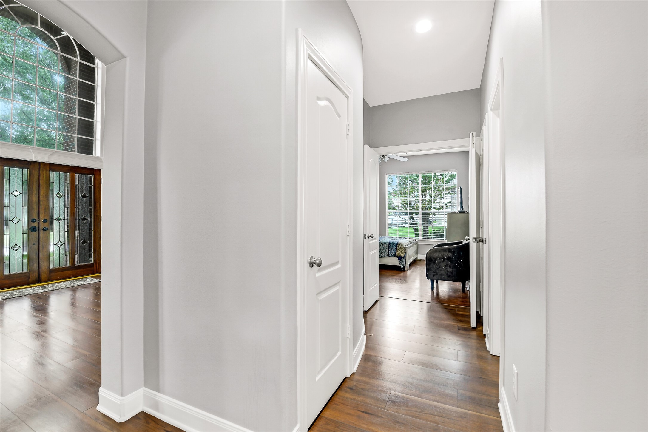 18414 Bull Pine Drive Spring, TX 77379 - Photo 33 of 43 a view of a hallway with wooden floor and a living room